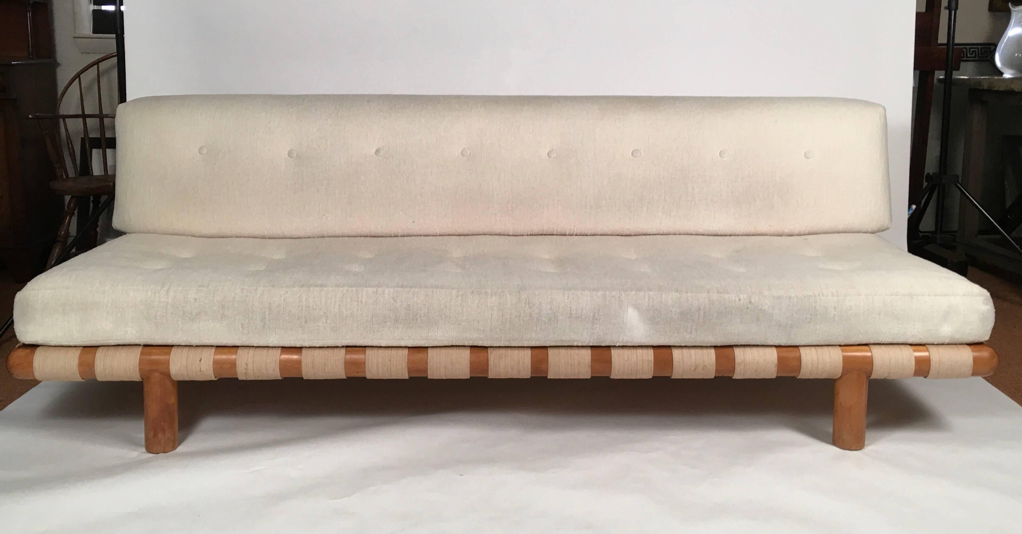 A beautifully made, comfortable and all original sofa, Model 1711, designed by T.H. Robsjohn-Gibbings (1905–1976) and made by Widdicomb, Grand Rapids, Michigan, circa, 1950, the original oatmeal linen or cotton upholstery on the back and seat