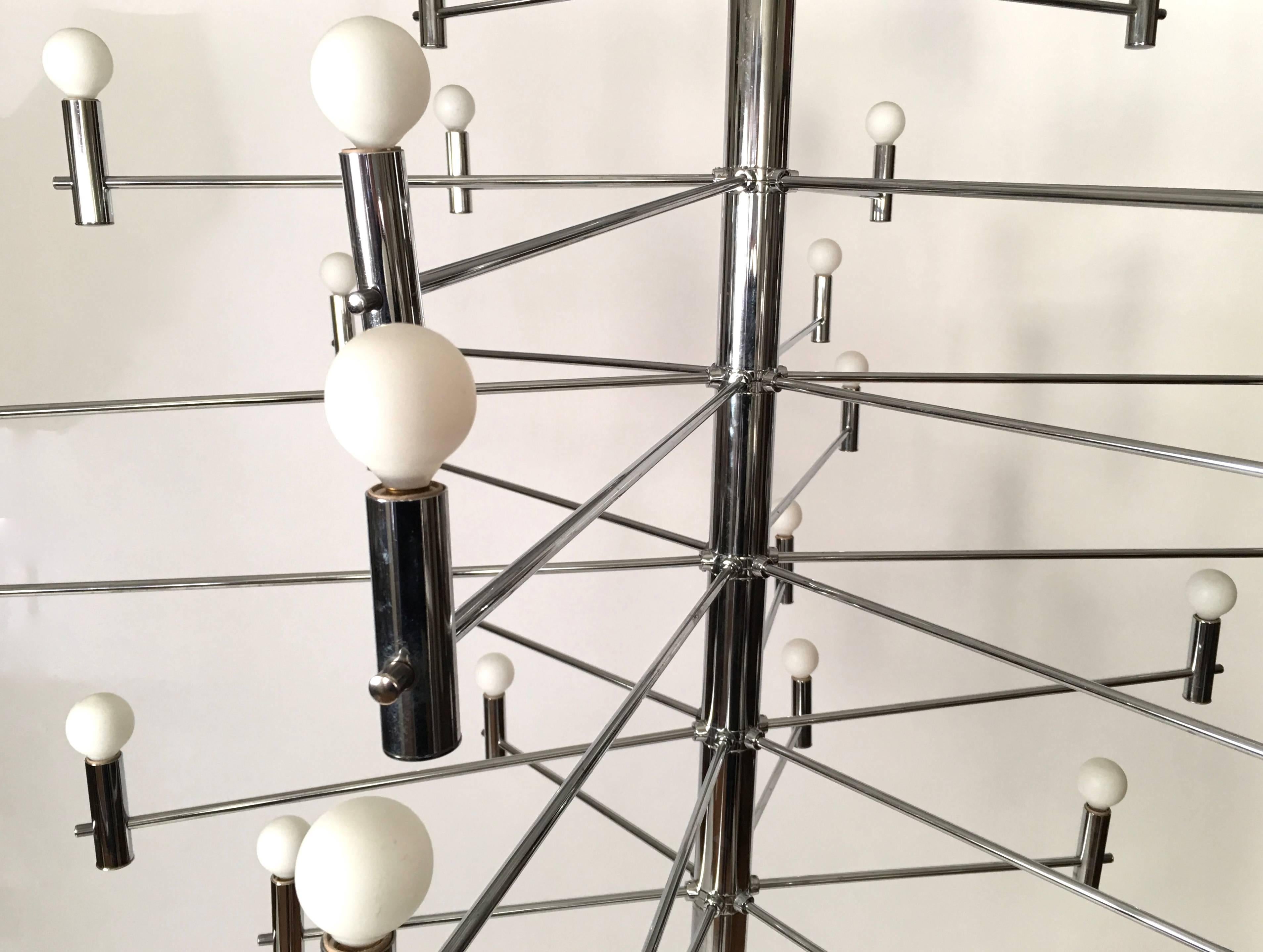 An Italian chrome metal chandelier, the central cylindrical shaft with arms branching out to form an open sphere, made by Metalspot Lighting Company, shown with spherical ping pong ball-sized bulbs. It's wonderfully atmospheric on a dimmer and
