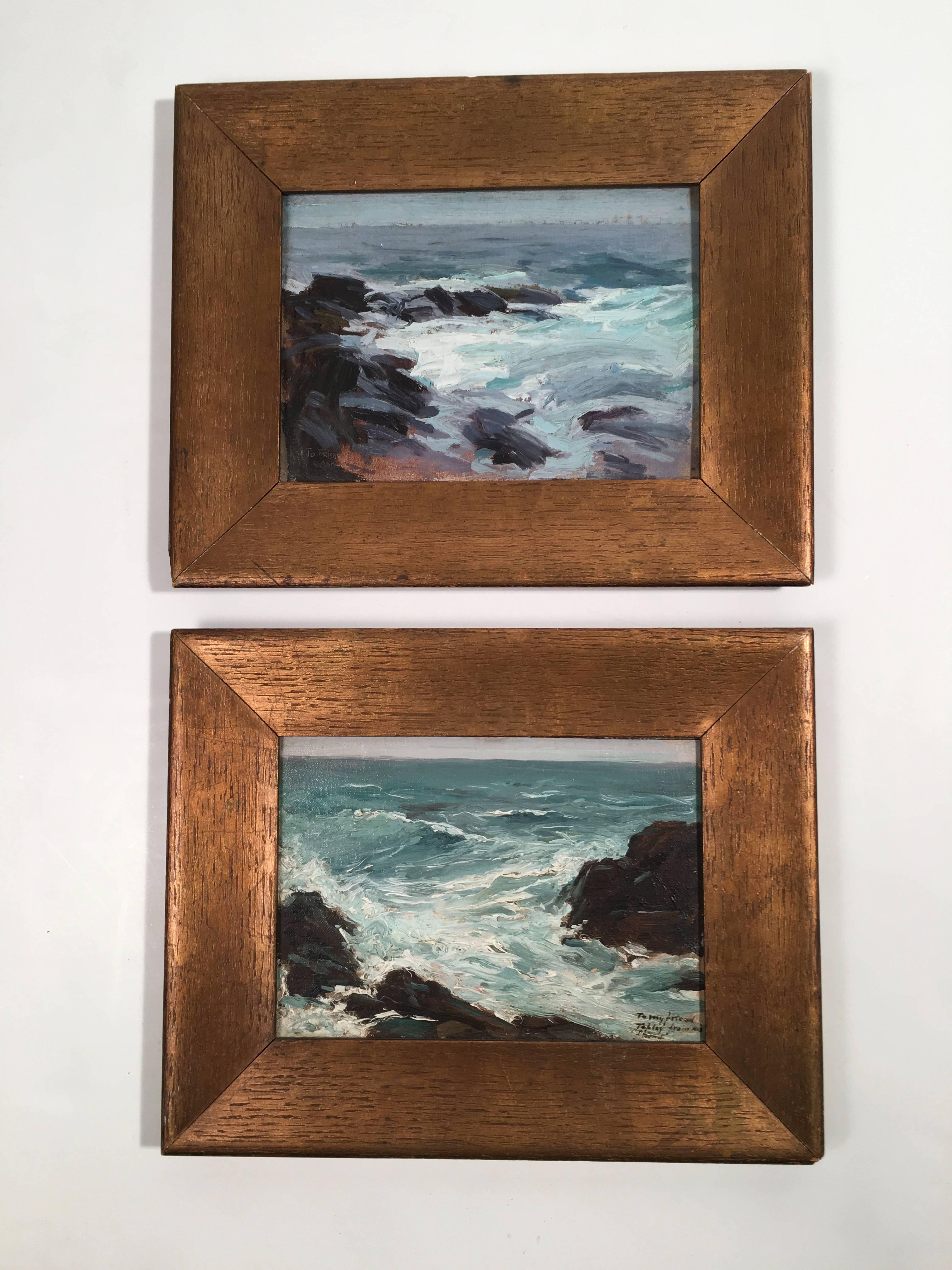 A pair of small, atmospheric seascape paintings, oil on board, in the manner of Edward Henry Potthast (1857-1927), depicting the rocky New England coast, likely Cape Ann, on the North Shore of Boston or Maine, in their original wide gilded oak