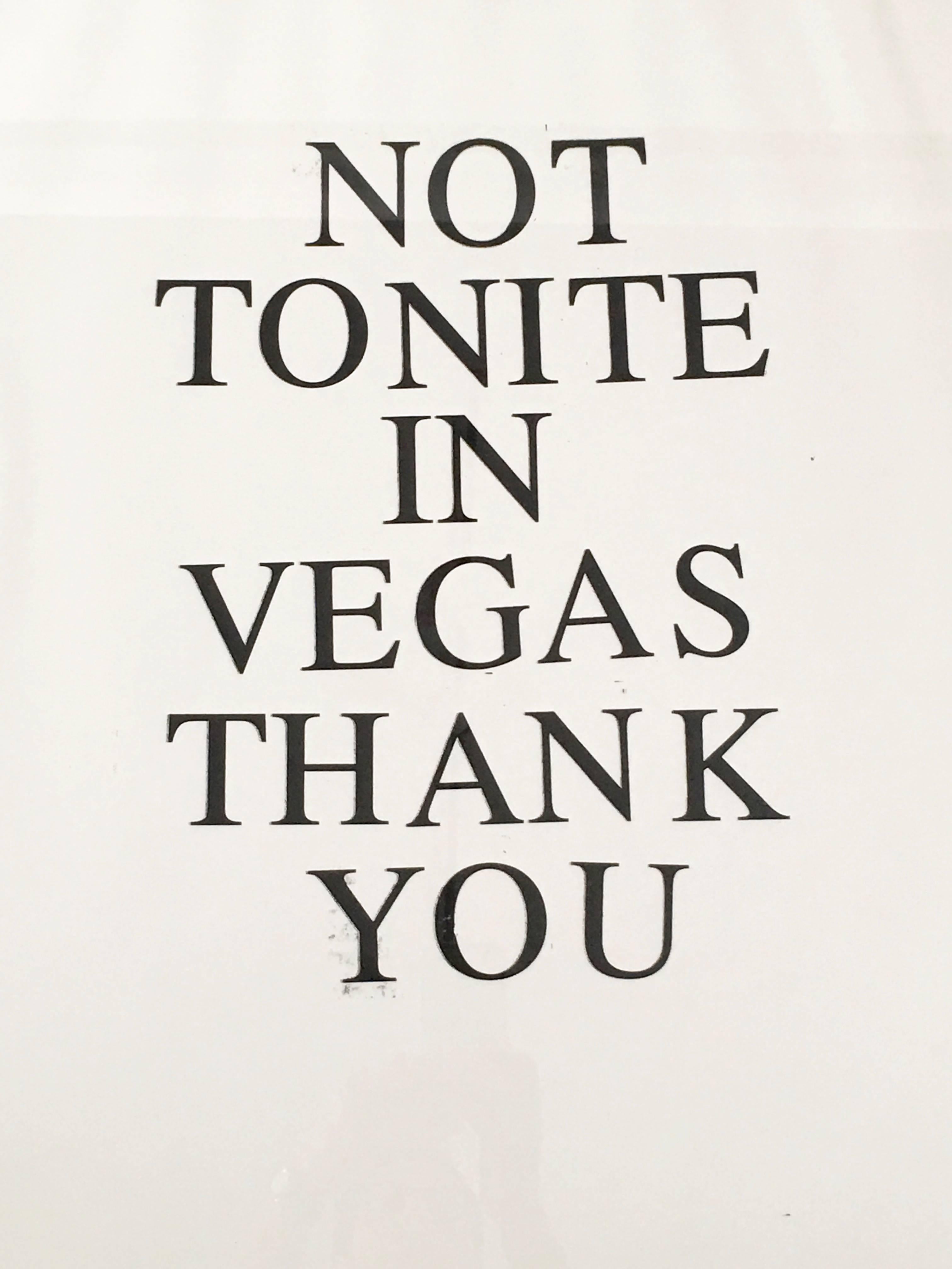 A graphic print by artist Jeffrey Teuton, with hand printed  large typeface reading 'Not Tonite in Vegas', number 1 of an edition of 5 . Signed lower right. Framed in high quality custom-made burnt orange lacquered wood frame with UV-resistant
