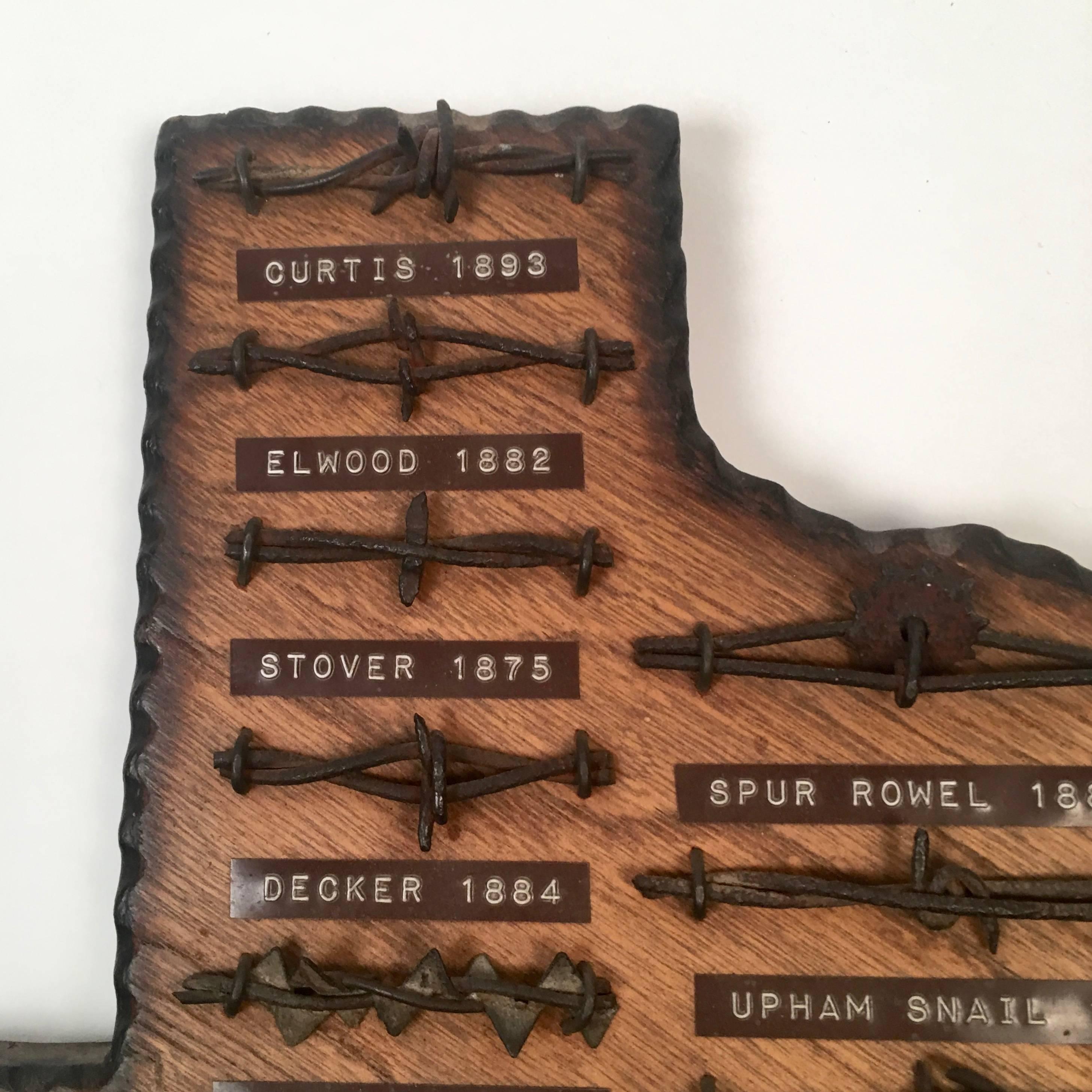 A Folk Art Texas collection of barbed wire, the carved wood panel mounted with a large variety of different types of barbed wire each one individually labelled with brown embossed Dymo labels, with pyrographic burned and perimeter. Great piece of