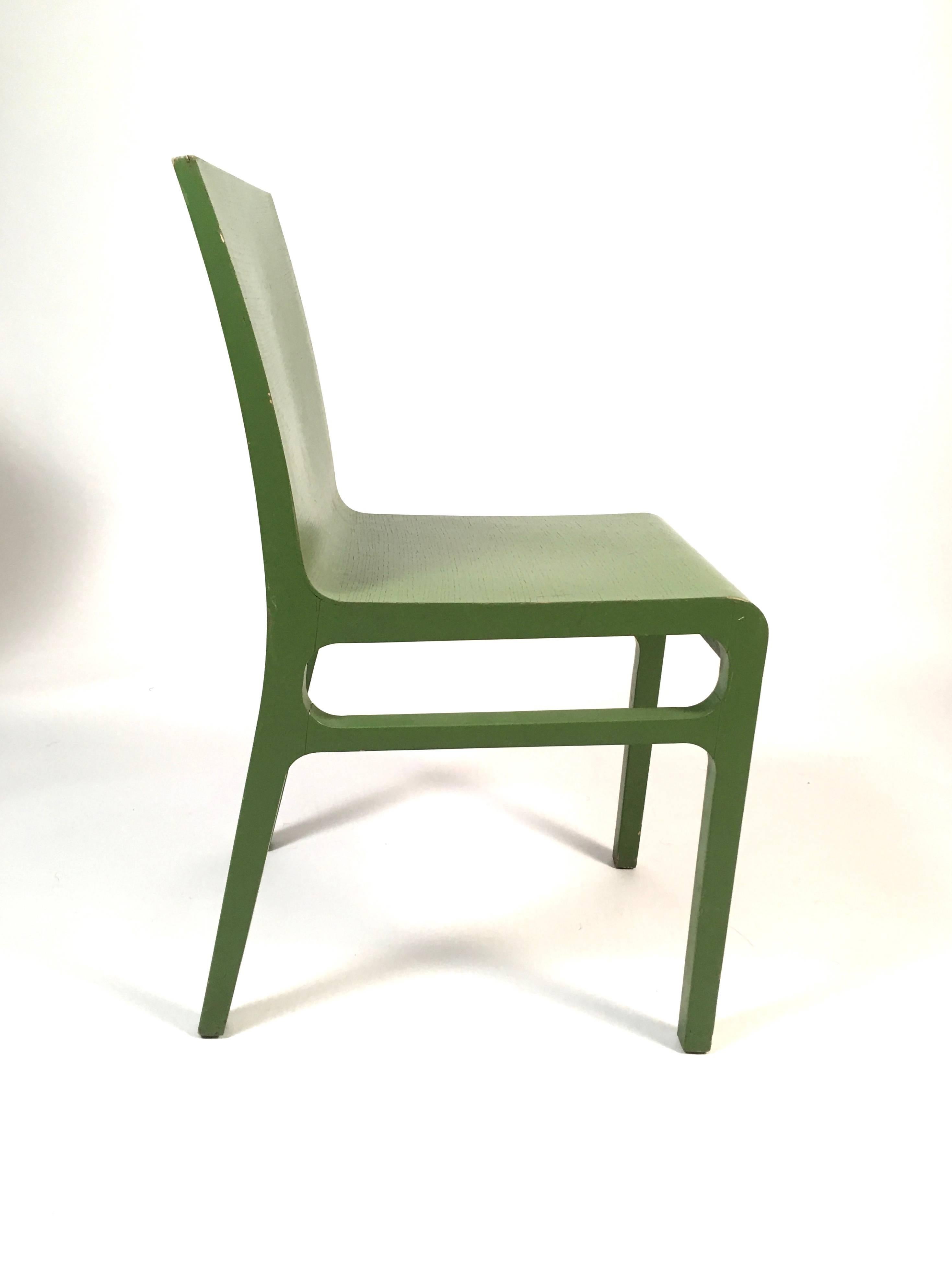 A set of eight Mid-Century Modern bentwood dining chairs from a tea room in England, painted in two different shades of green, four in hunter green and four in apple green, with comfortable curved backs and seats, the legs joined by cross