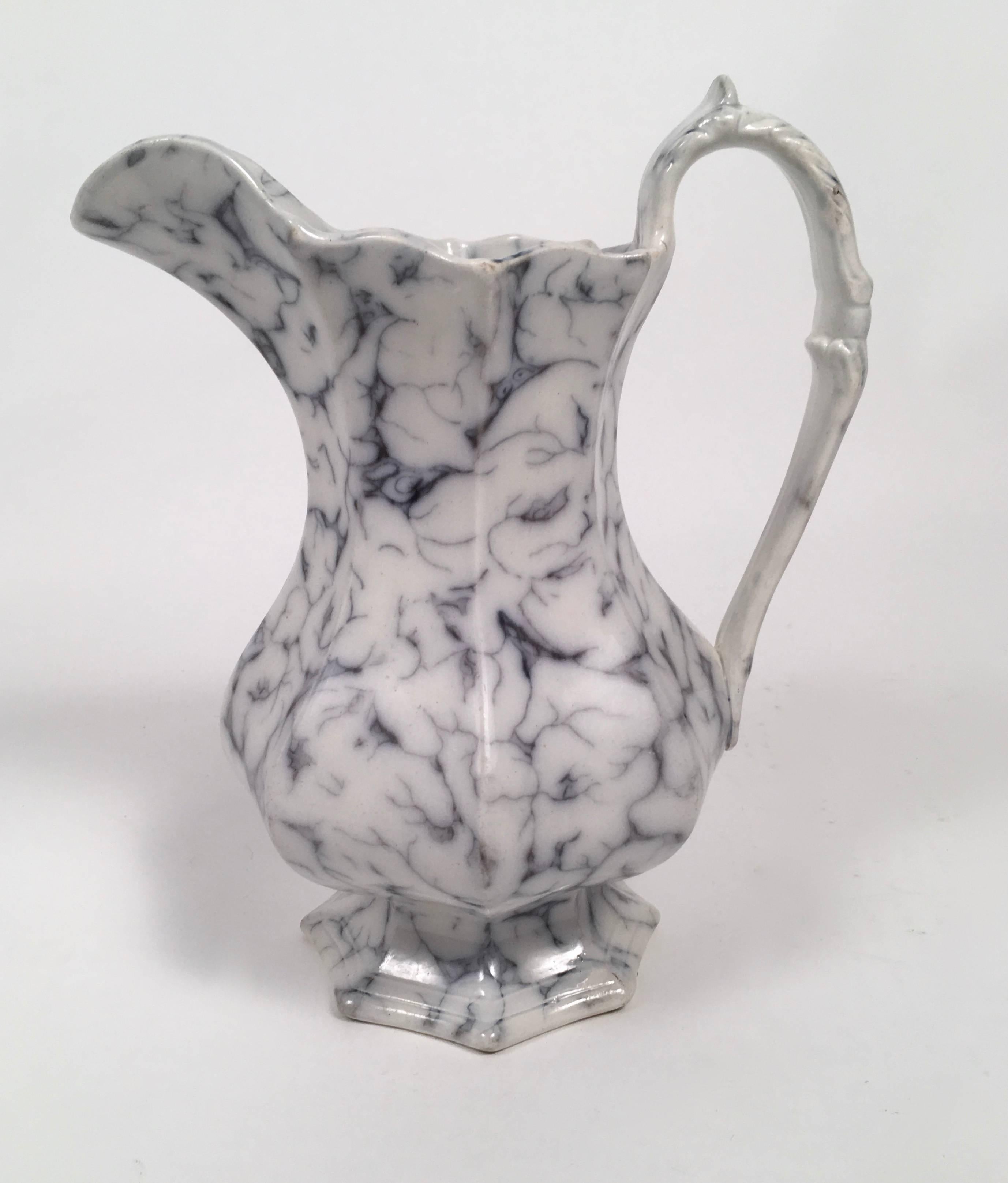 A 19th century Staffordshire white pottery pitcher with wonderful faux marble decoration overall, transfer printed in dark blue grey on white, the base marked with the pattern name LAZULI, an English romantic reference to the stone lapis lazuli. The