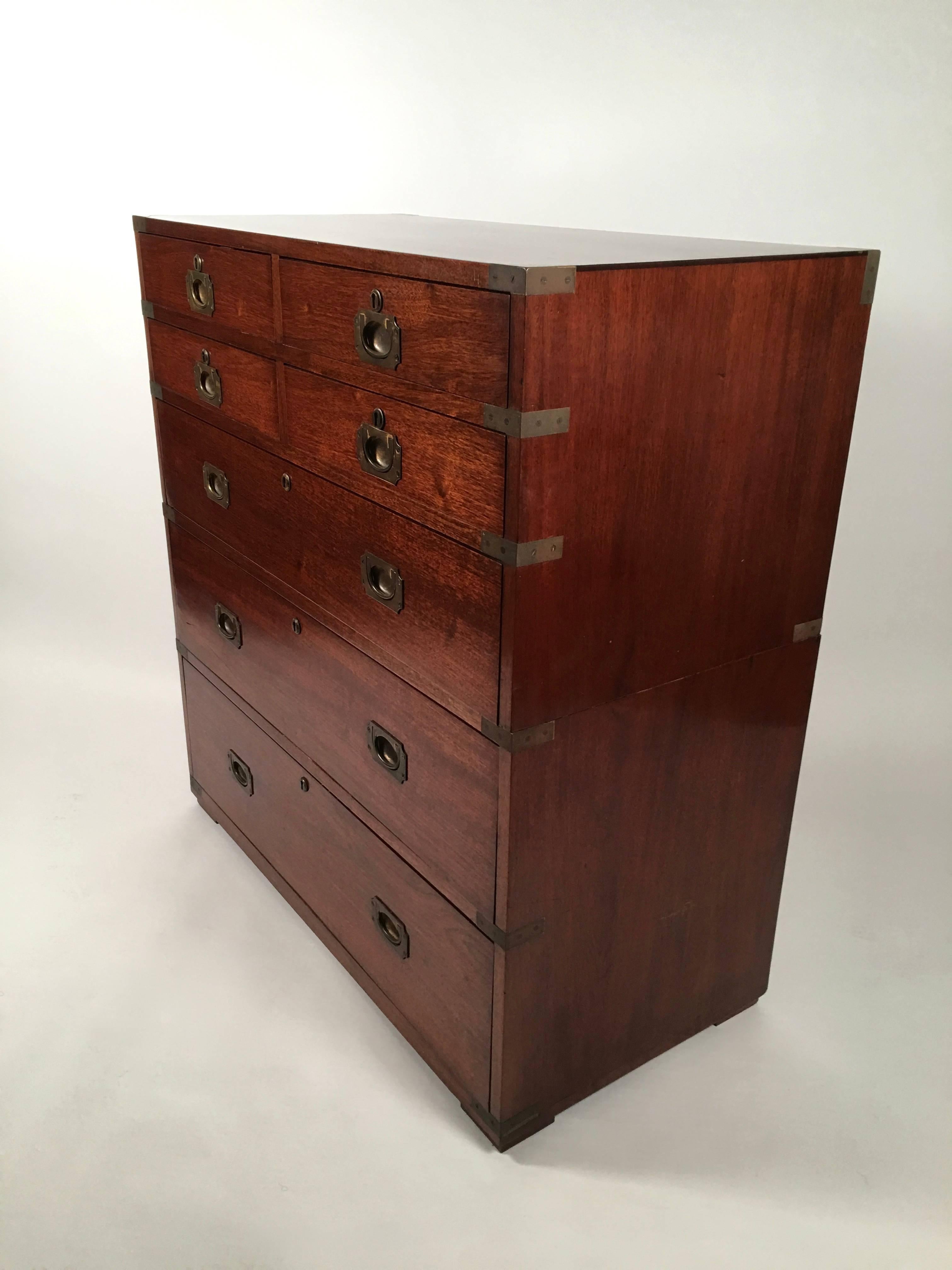 A fine quality Irish Campaign chest in mahogany, with Ross & Co., Ireland plaque inside a top drawer, late 19th century, of rectangular form, with brass corner mounts and brass pulls, and with four short drawers over three long drawers. Brass locks