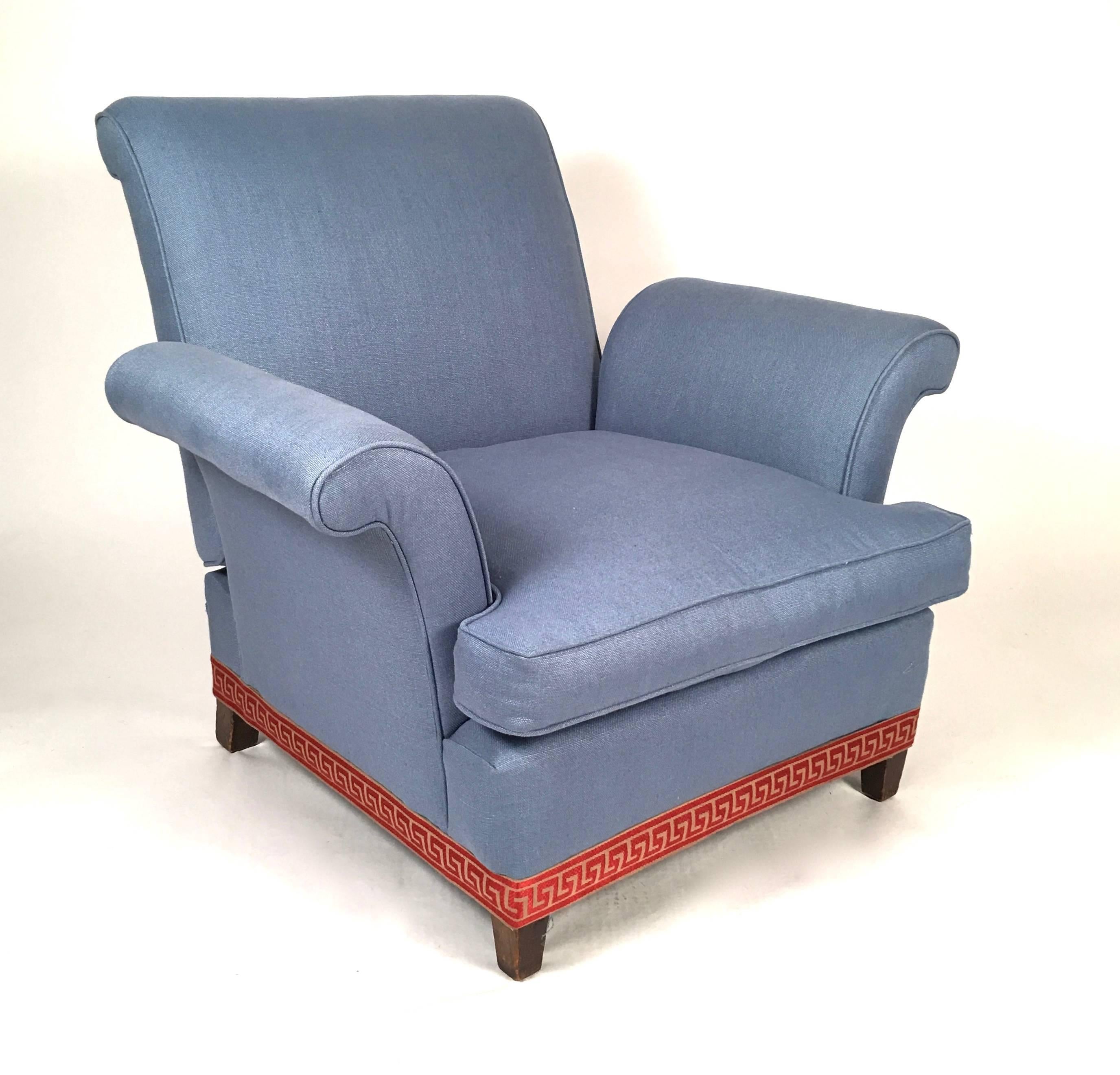 A vintage club chair with scrolled arms and a reclining back, which may be angled in several positions with the lever on the back which lifts up, recently re-upholstered in blue linen/cotton, with down-filled loose seat cushion and terra cotta Greek