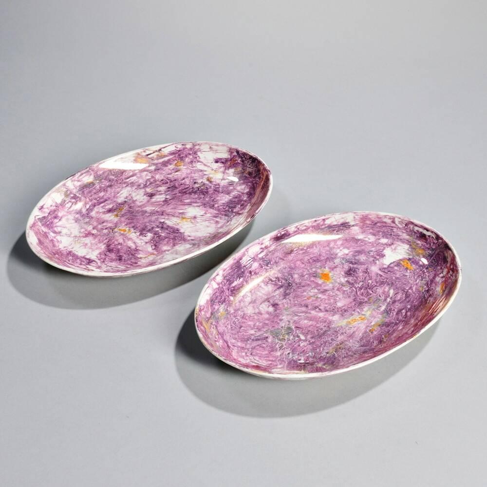 A pair of early 19th century Wedgwood pink moonlight lustreware oval platters, English, circa 1800-1815, with orange, pink, purple and gray glazed decoration, in imitation of mother-of-pearl. Wonderfully 'modern' in its marbleized design, moonlight