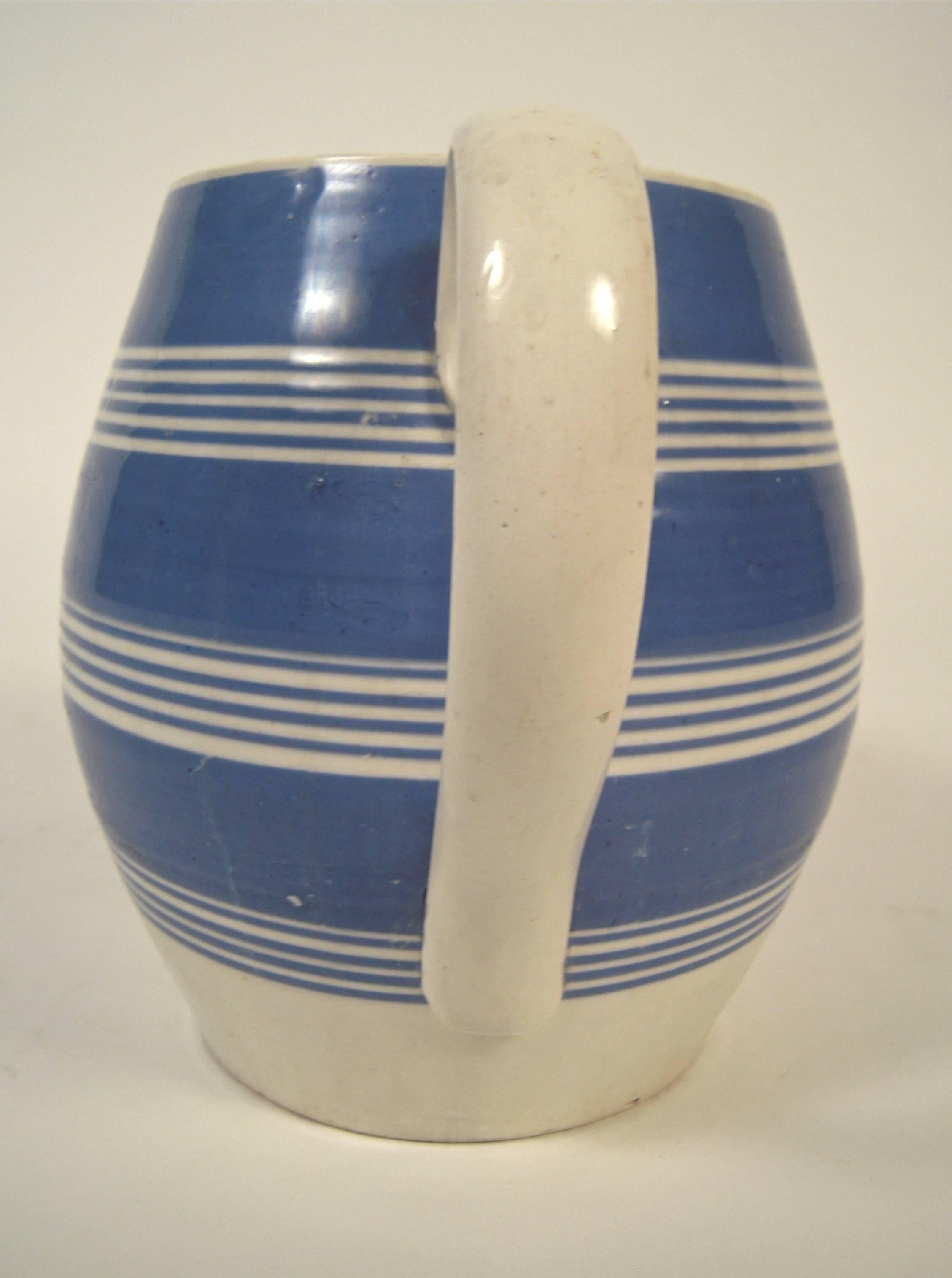 blue and white striped pitcher