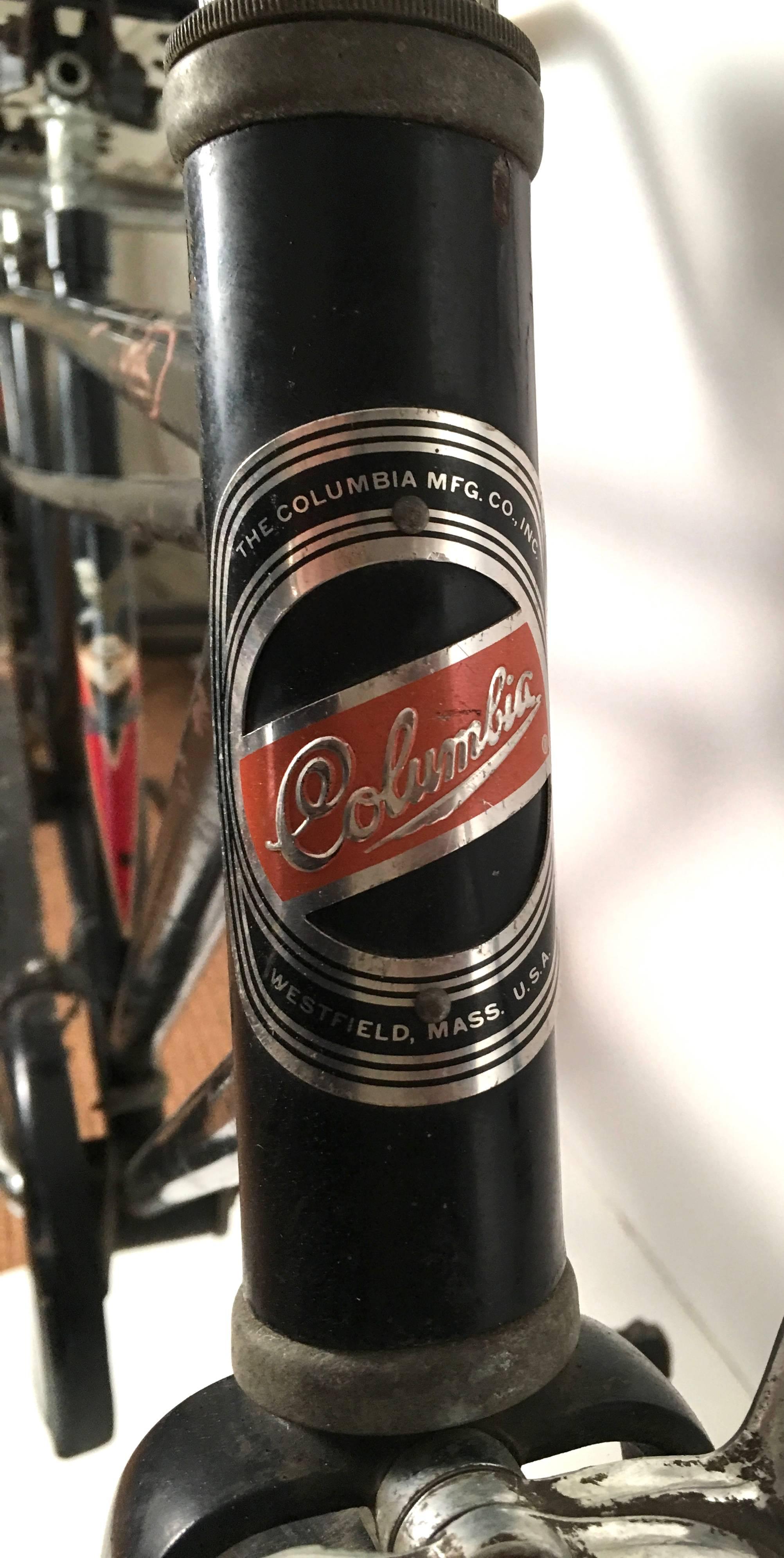 A rare Columbia four seat tandem bicycle, made in Westfield, Massachusetts, circa 1964, with black-painted frame with original decals, pinstriped front and rear fenders, white-wall tires, front brake, black and white seats, and a three-chain drive.