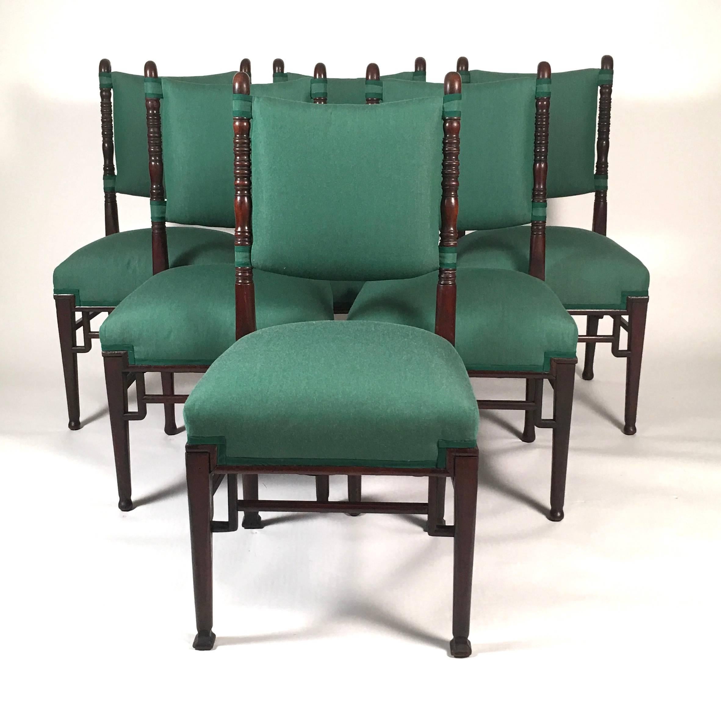 An unusual and well made matched set of six Aesthetic movement period dining chairs by Charles Yandell and Co, New York, with upholstered backs and seats, the side rails with shepherd's crook swan's heads and necks over ring turned decoration, the