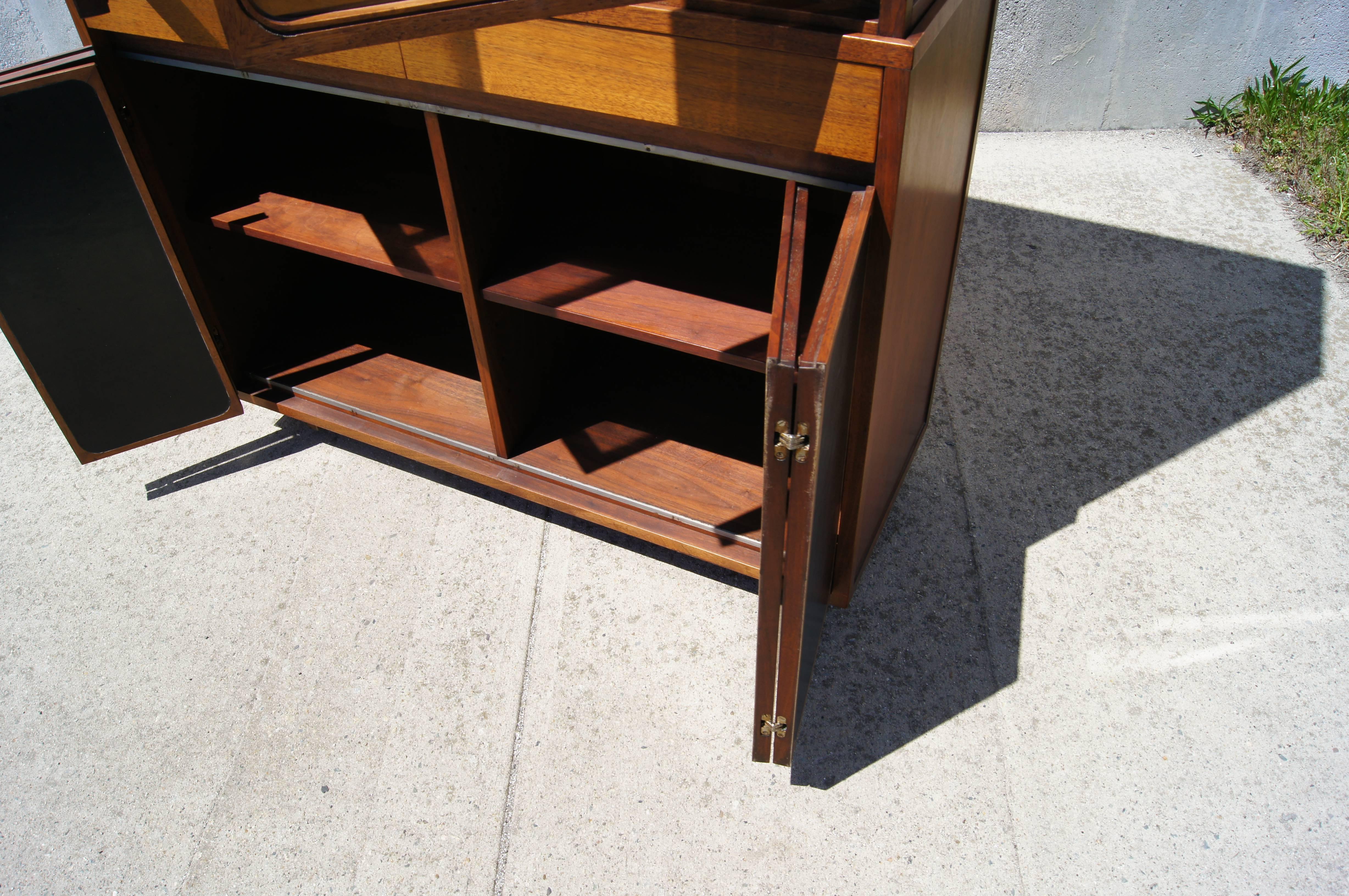 Mid-20th Century Tall Walnut and Leather Cabinet with Glass Doors by Paul McCobb for H. Sacks For Sale