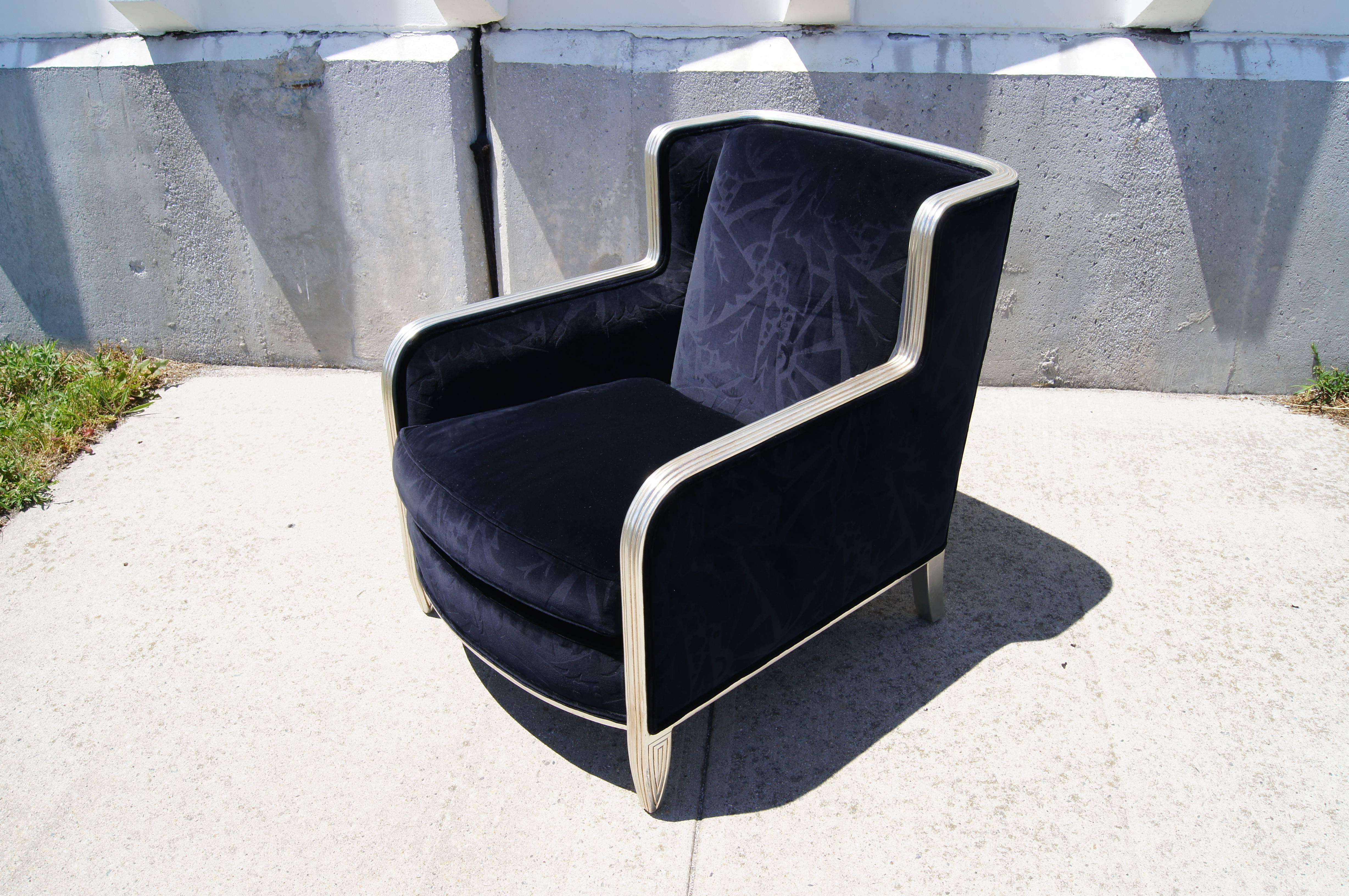 This luxurious club chair comes from Chicago-based custom furniture maker Interior Crafts. It is a beautiful late-20th- century interpretation of the art deco style, with deep blue cut velvet upholstery and a carved hardwood frame gilded with silver