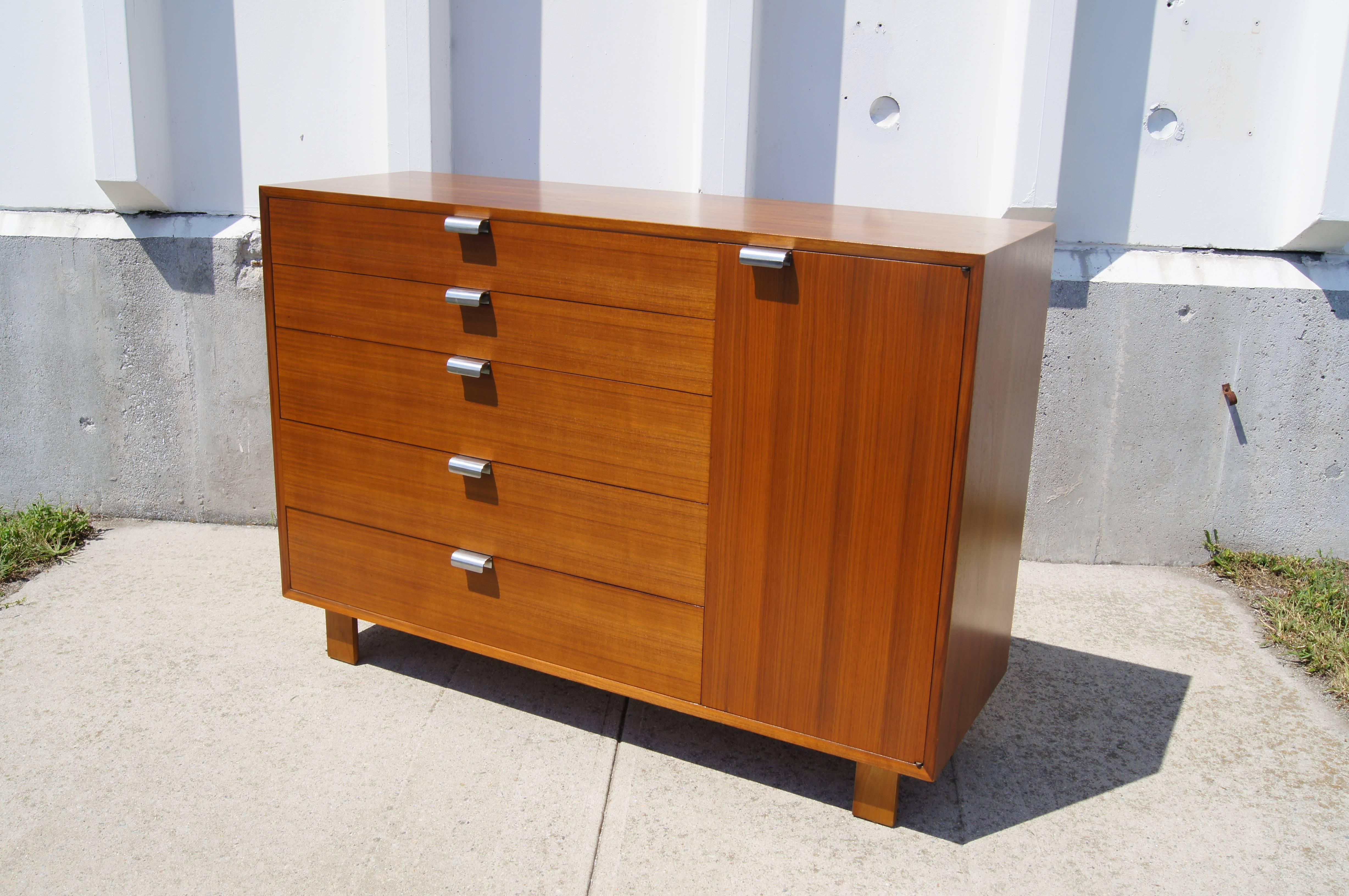 George Nelson designed this chest or cabinet, model #4621, as part of Herman Miller’s modular basic storage components. The warm walnut case features five drawers and a cabinet with two adjustable shelves — all set with chrome-plated J pulls.

A