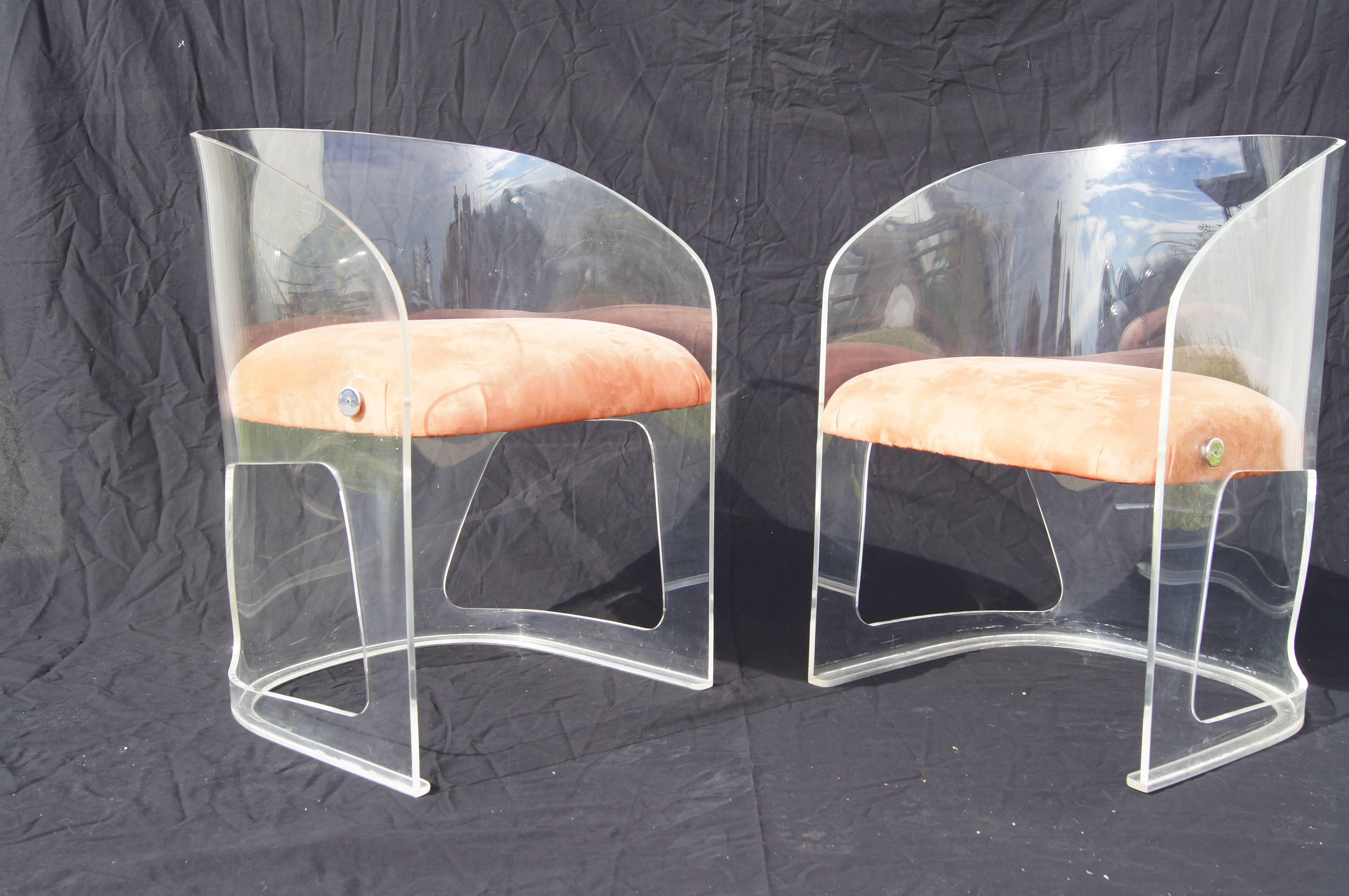 Vladimir Kagan began his experiments with Plexiglas seating in 1969. Designed in 1970, the curvaceous Lotus chair lightens the look of his Classic organic forms. With a seat upholstered in a lush apricot-colored suede, the chair is equally at home