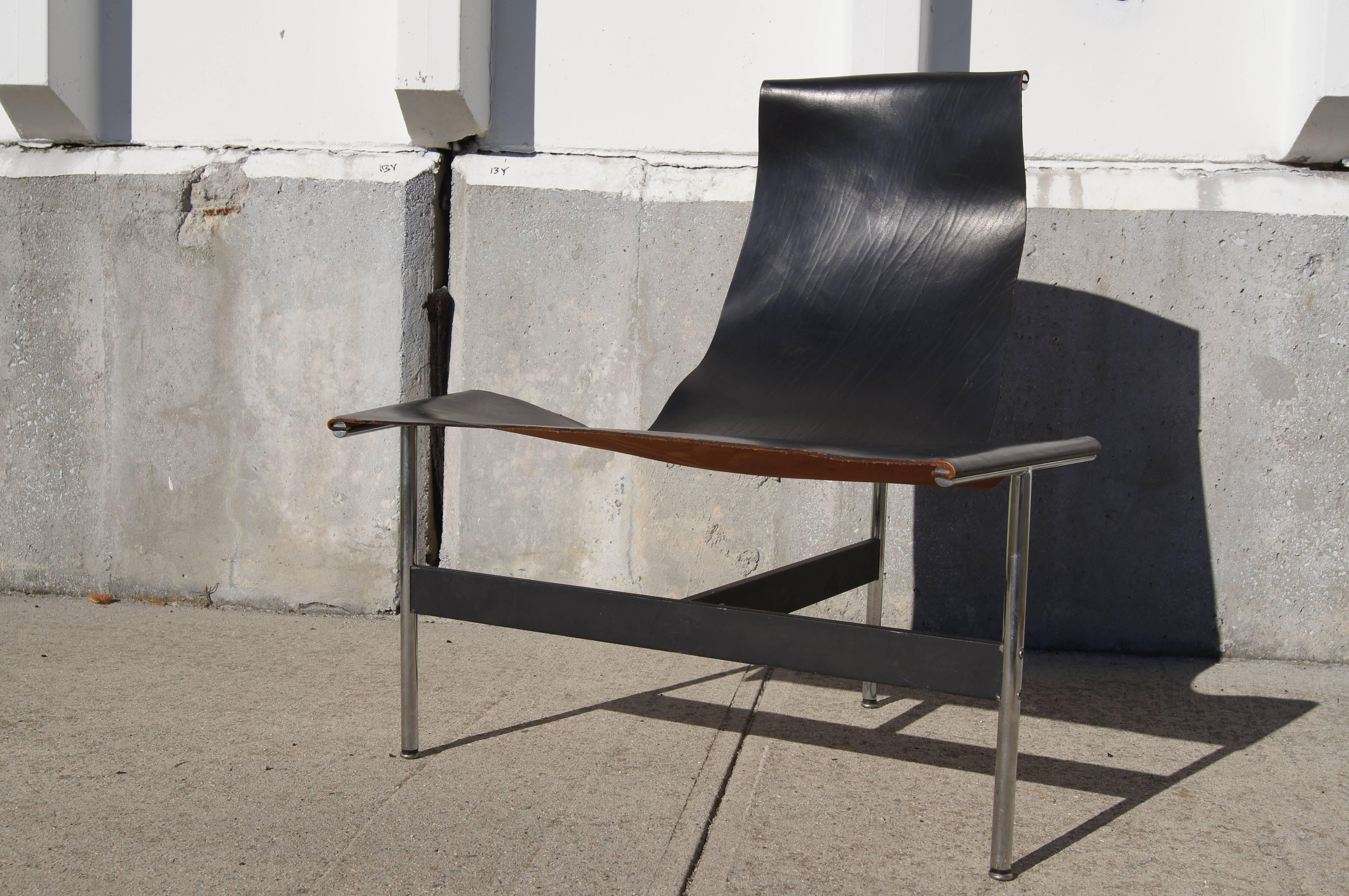 William Katavolos in partnership with Douglas Kelley & Ross Littell designed the iconic sling-back T chair in 1952 as model 3LC in Laverne International's sculptural New Furniture series. Hidden screws attach the leather seat to a frame of chromed