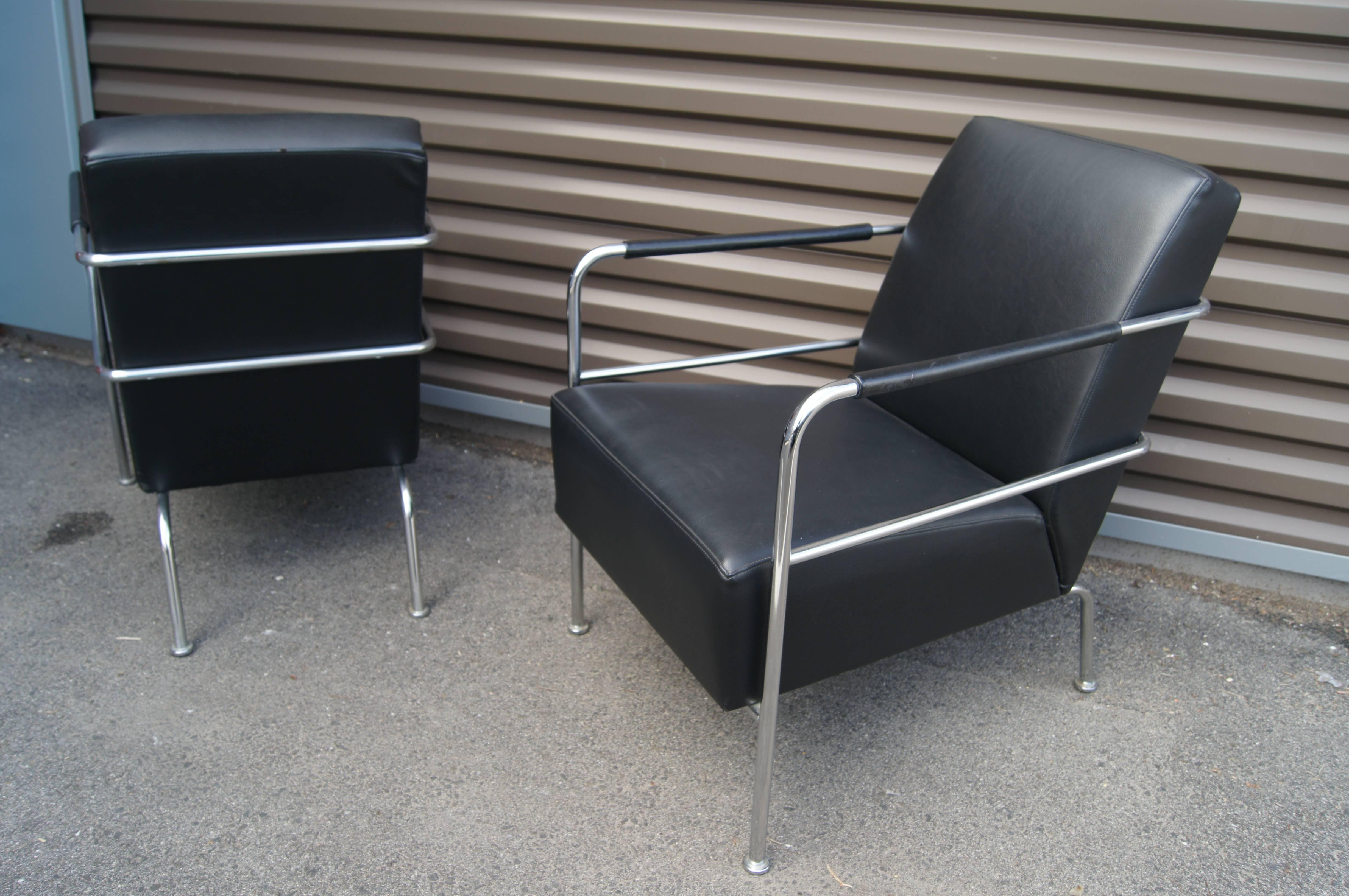 Gunilla Allard's cinema chair for Lammhults offers deep comfort in an elegantly minimal design. The chrome-plated tubular steel frame features leather-covered armrests; the ample cushioning is snugly upholstered in soft black leather. 

Two chairs