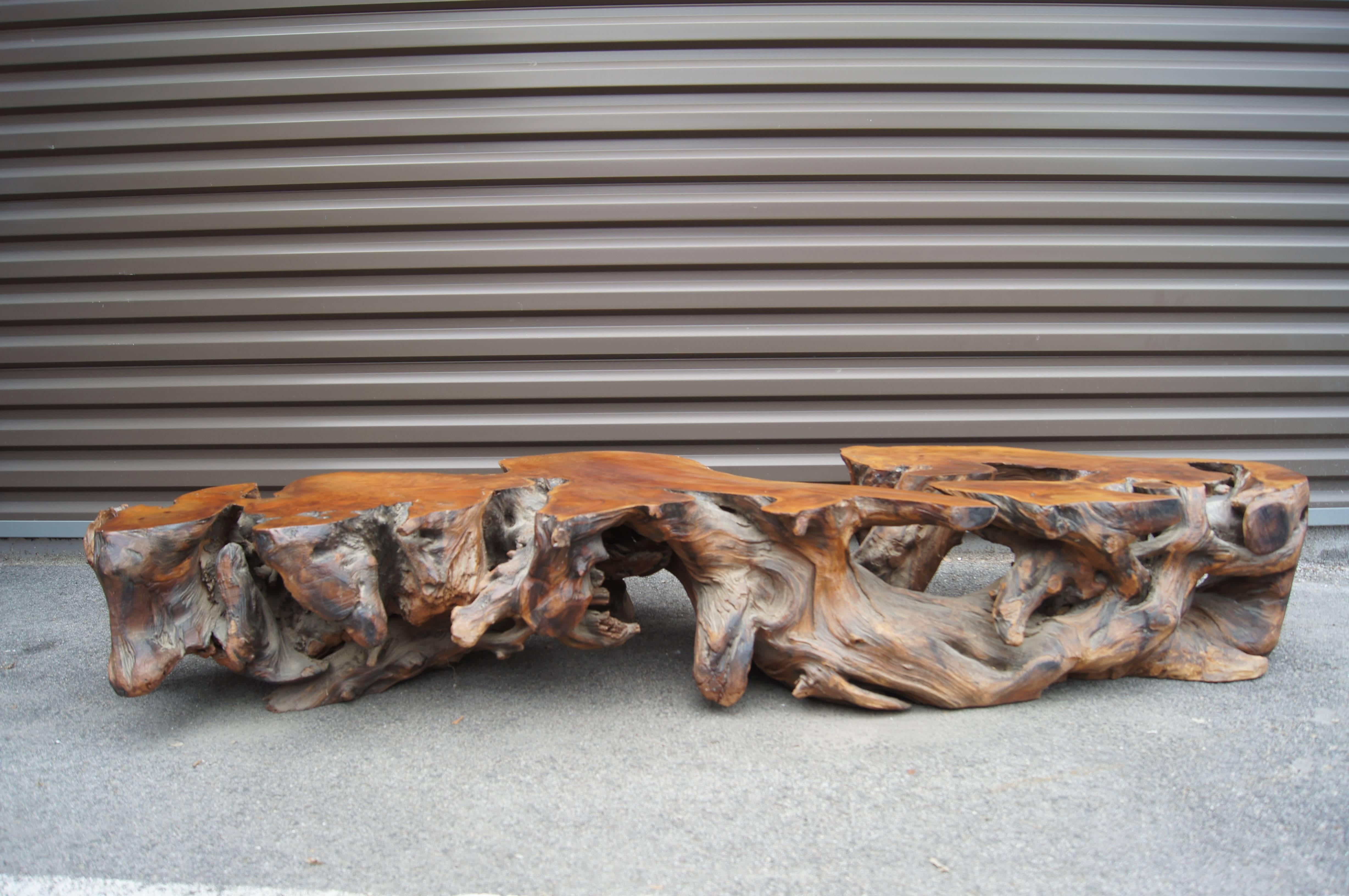 Created in the 1970s out of a single piece of redwood driftwood, this long and low coffee table contrasts the natural patina of the organic form with a planed and polished top that showcases the beautifully figured grain.