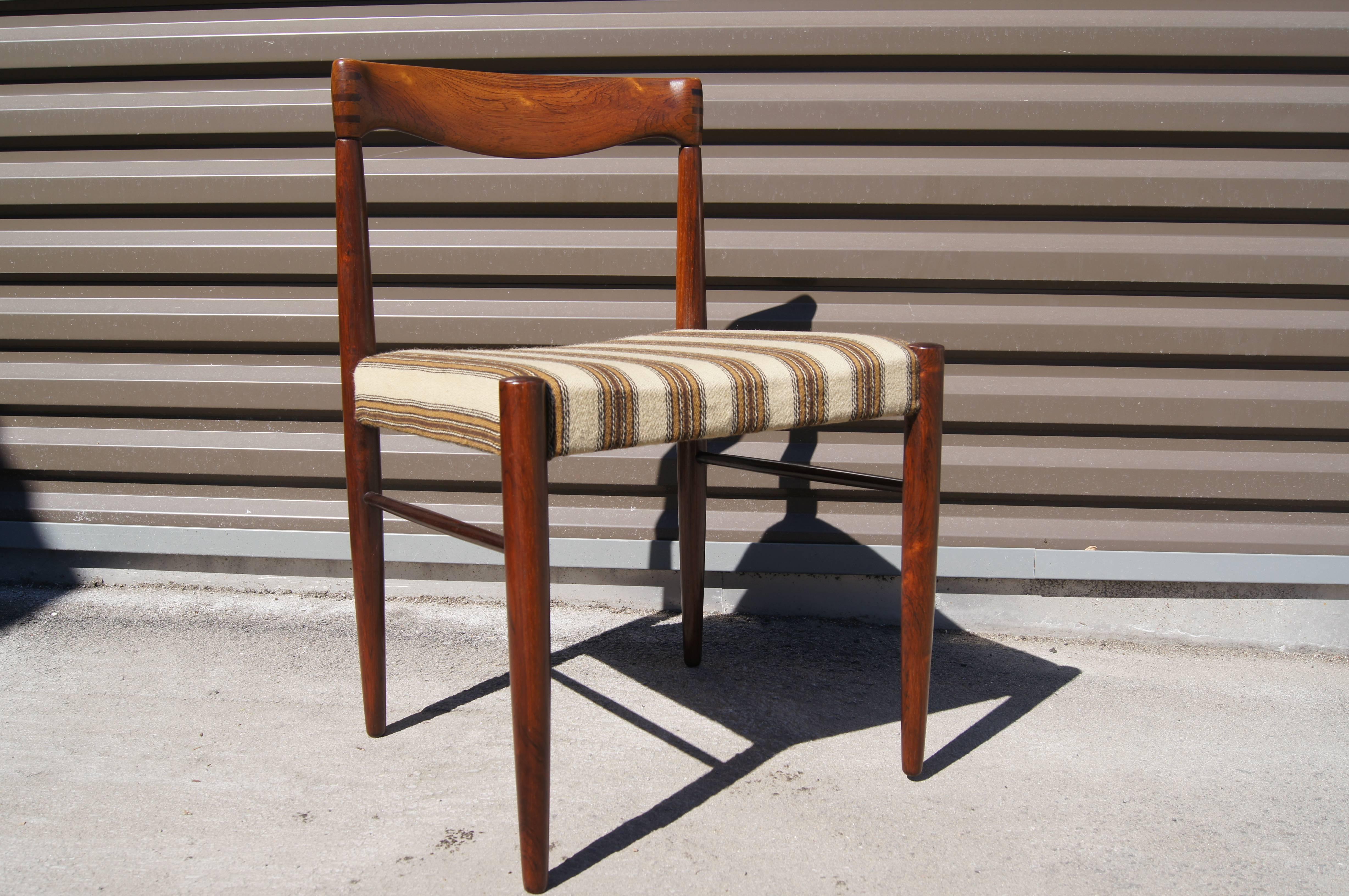 H. W. Klein designed this elegant set of dining chairs for Bramin Møbler in the 1960s. The exposed joints and distinctive curve of the backrest are further enhanced by the rosewood's rich grain.