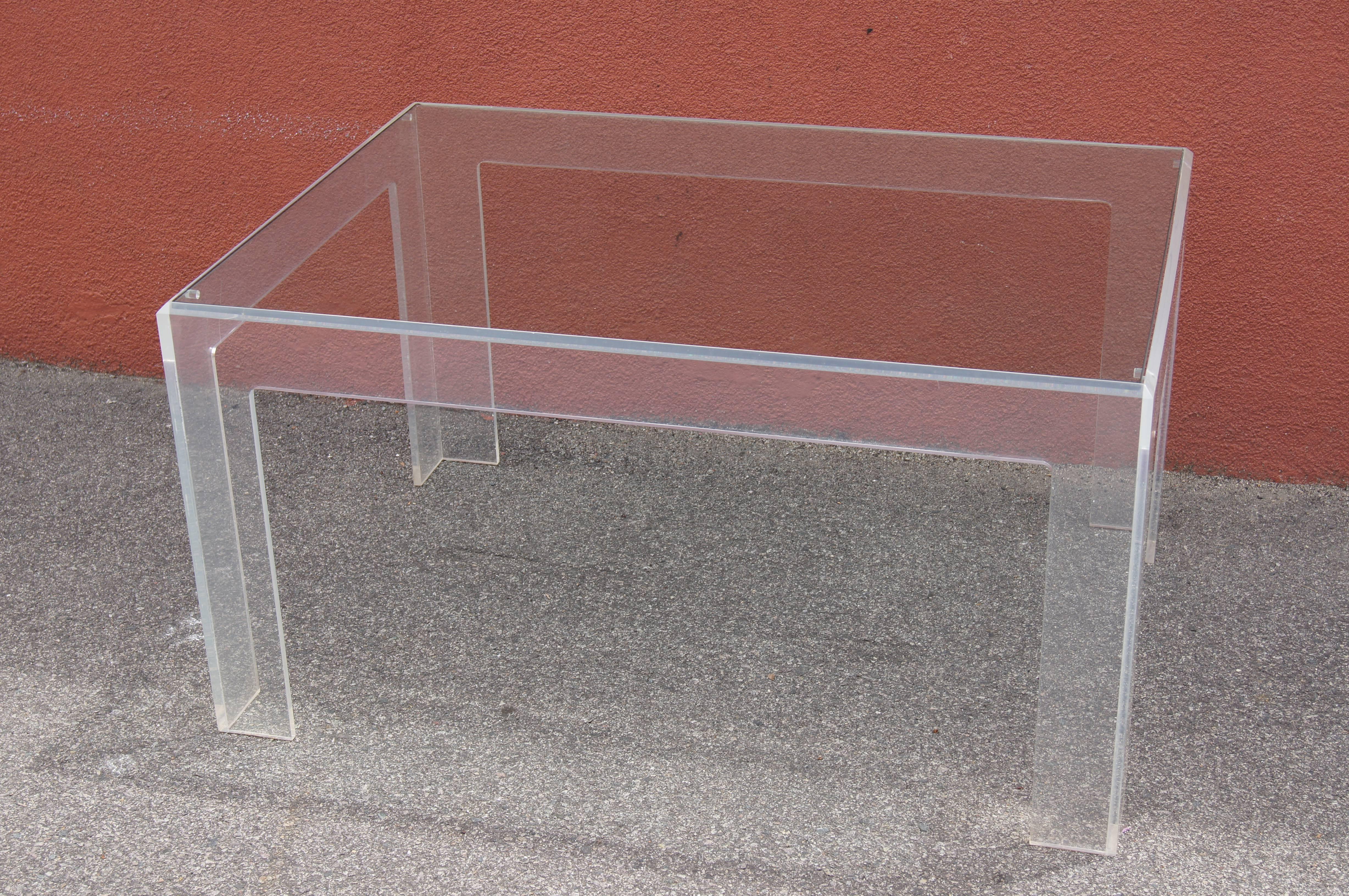 Acrylic master Jeffrey Bigelow designed and produced this Lucite coffee table, whose clarity of line works well in both modernist and eclectic settings. The piece is signed and dated 