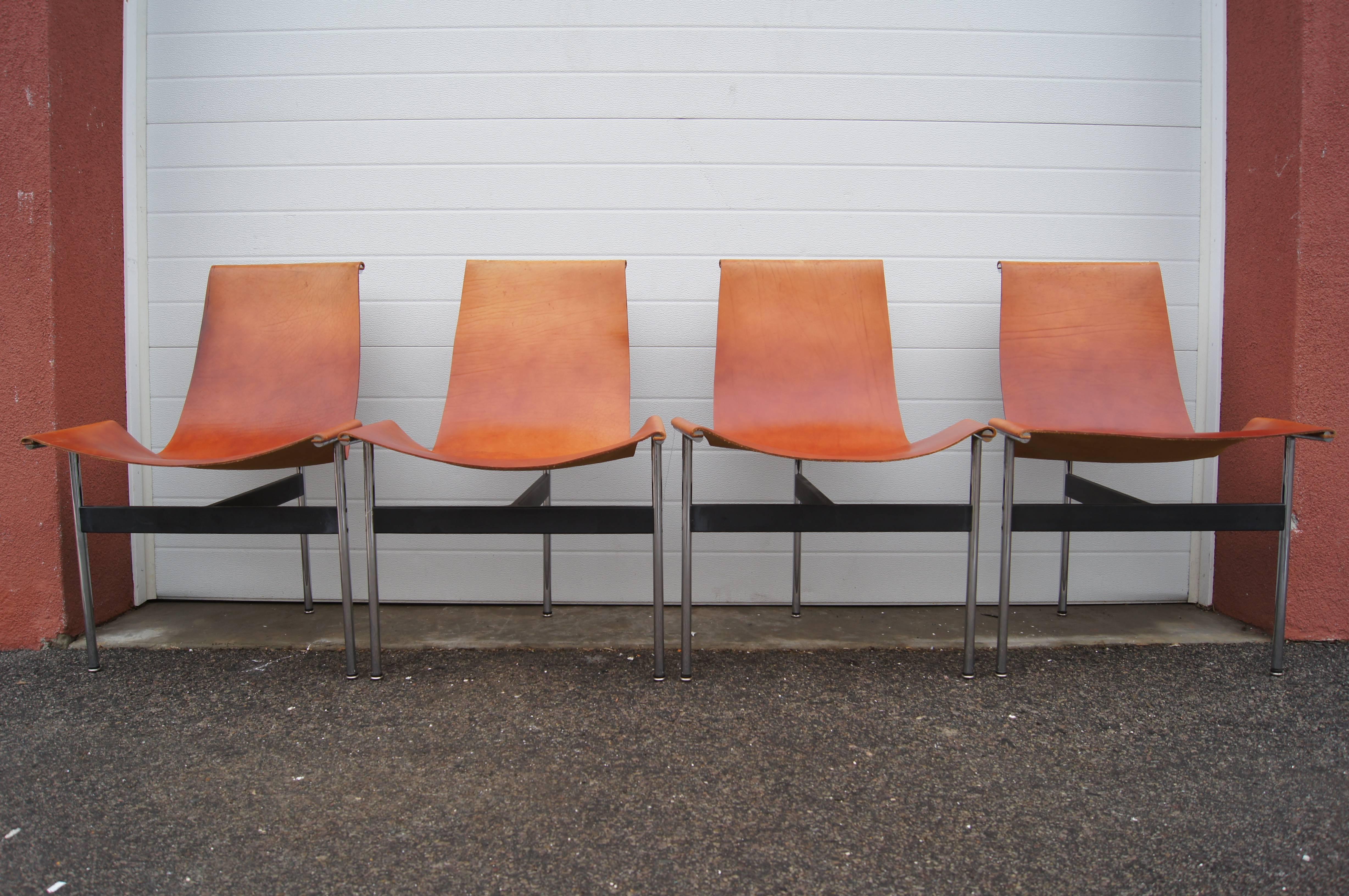 William Katavolos in partnership with Douglas Kelley & Ross Littell designed the iconic sling-back T chair in 1952 as model 3LC in Laverne International's sculptural New Furniture series. Hidden screws attach the leather seat to a frame of chromed