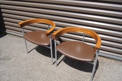 Sillón PK11 de acero inoxidable, fresno y cuero de Poul Kjærholm