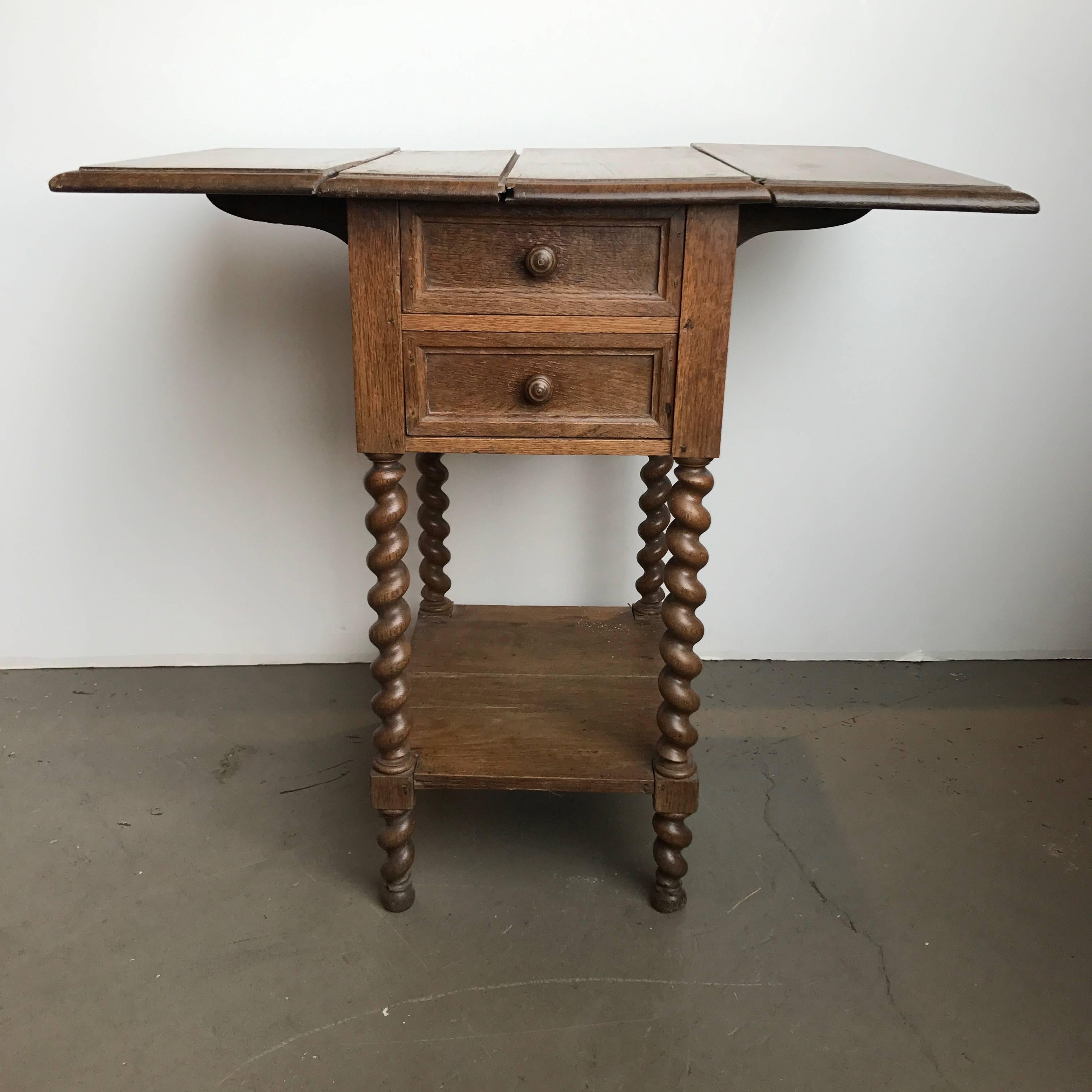 19th century French barley twist oak drop leaf work table. With back door compartment.
