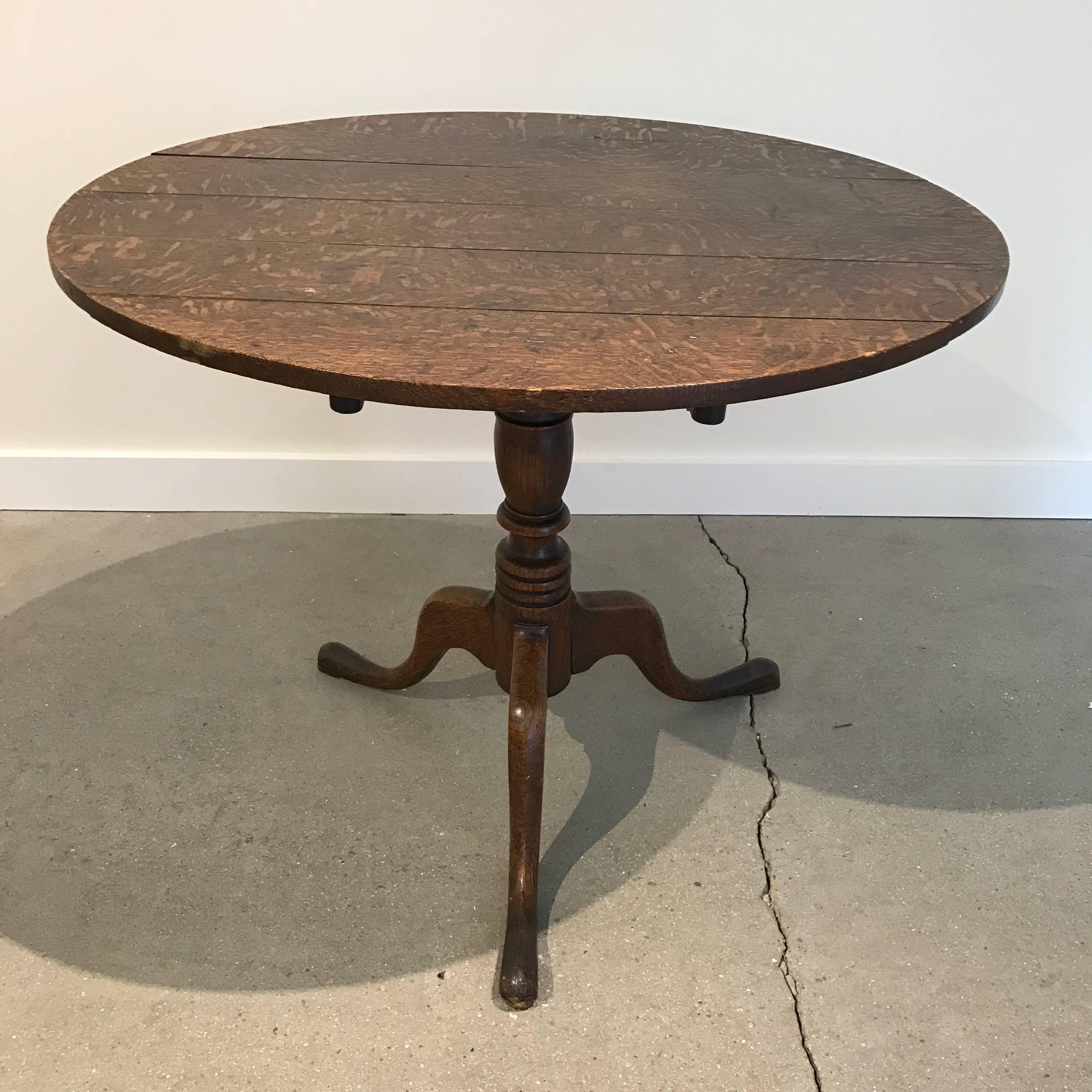 19th century English oak tilt-top table with tripod base.
