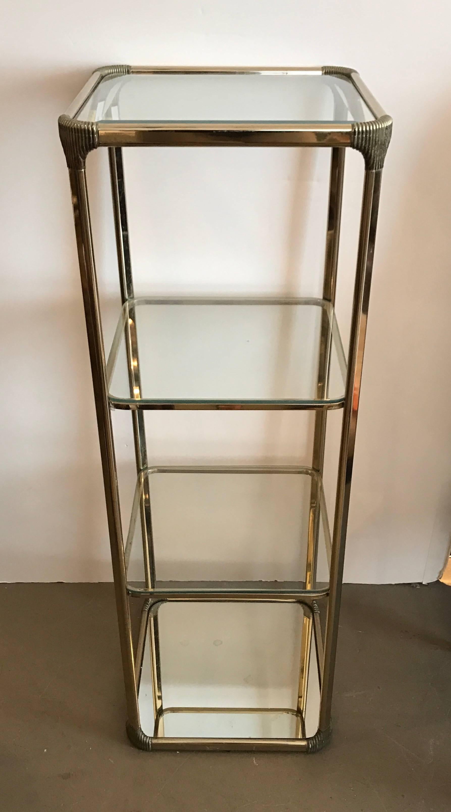 Vintage French etagere with glass shelves and mirrored base.