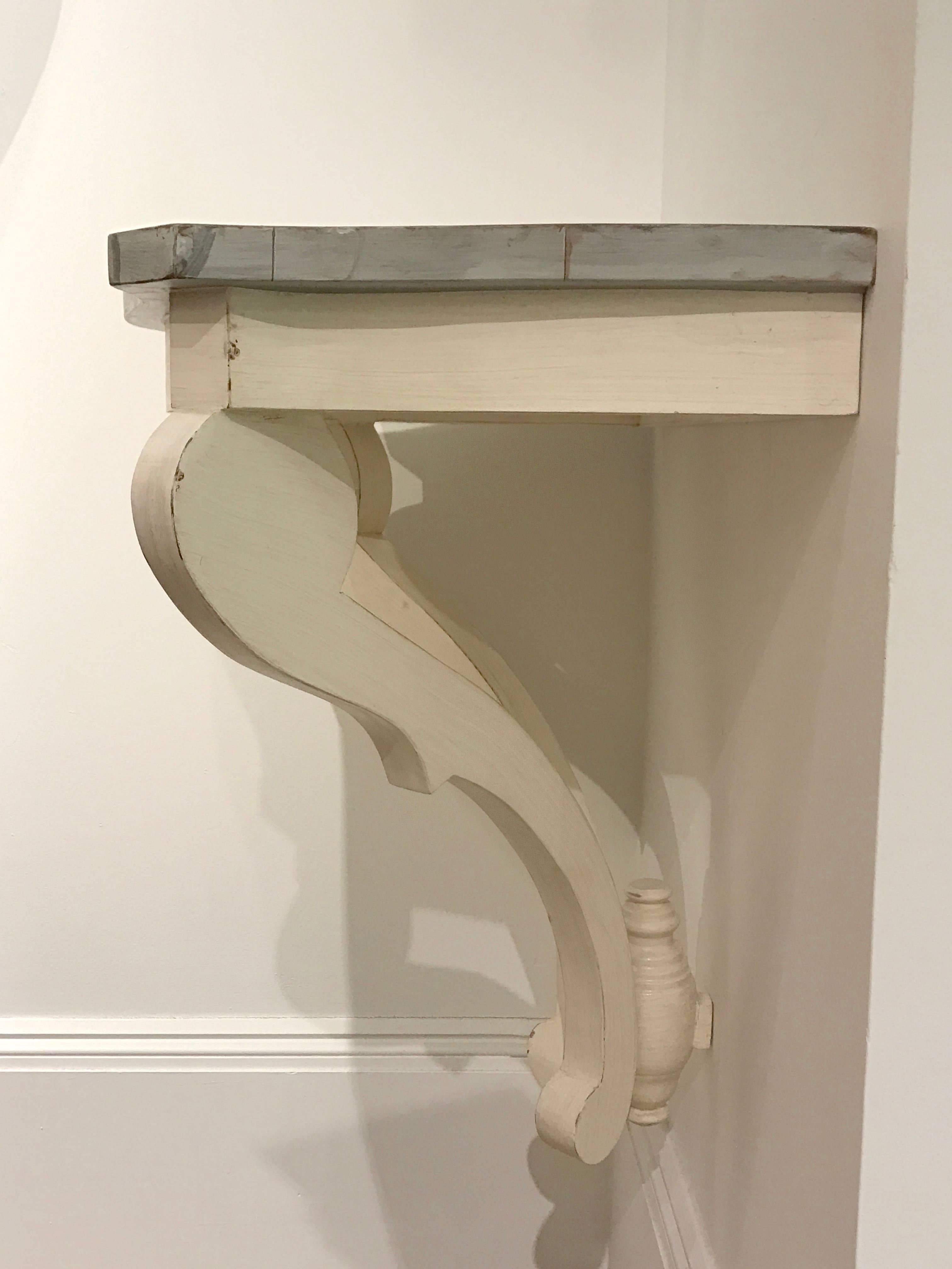 Painted wall mount bracket or console with marbleized top.