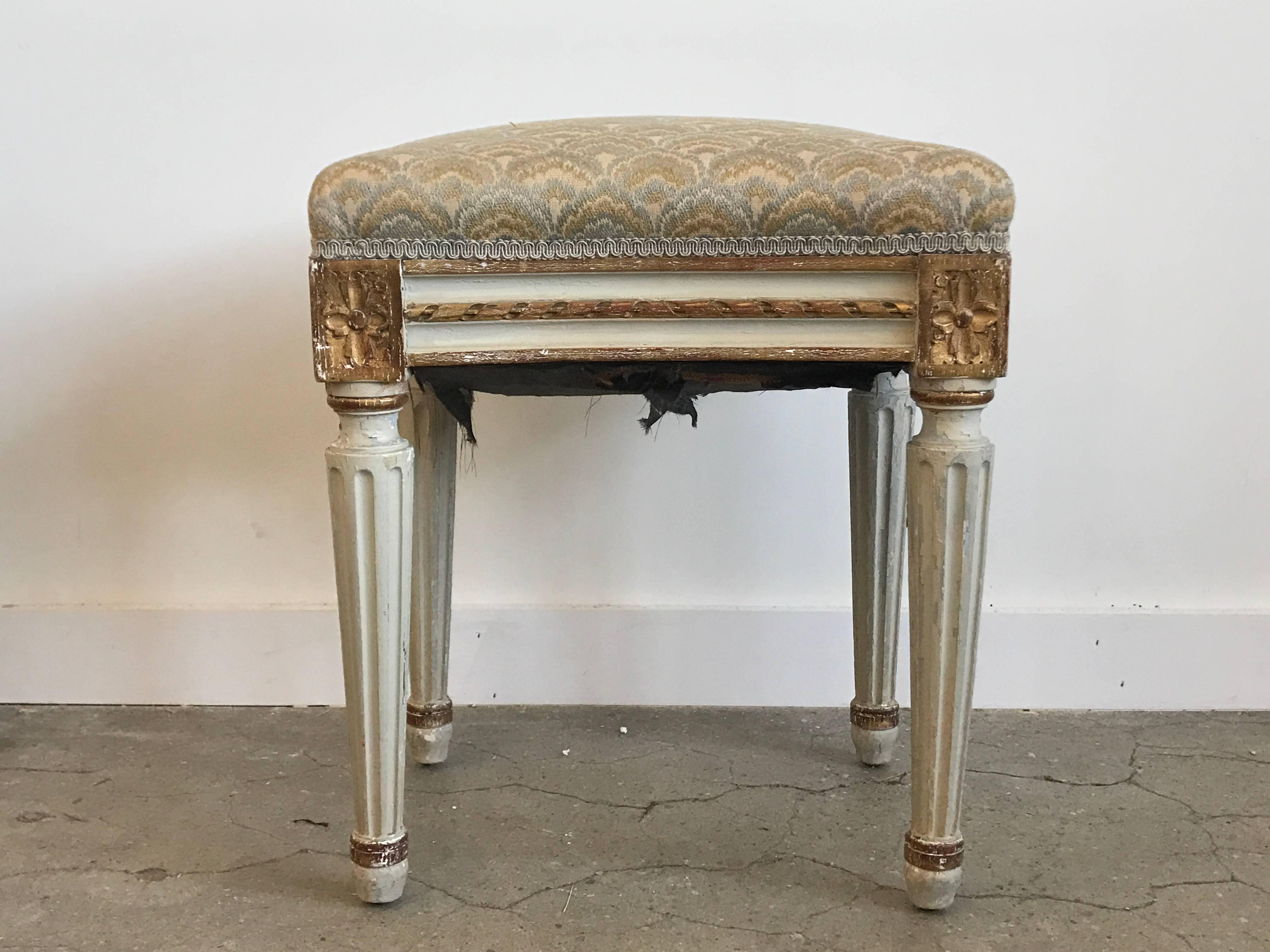 Louis XVI style paint and gilt upholstered stool.