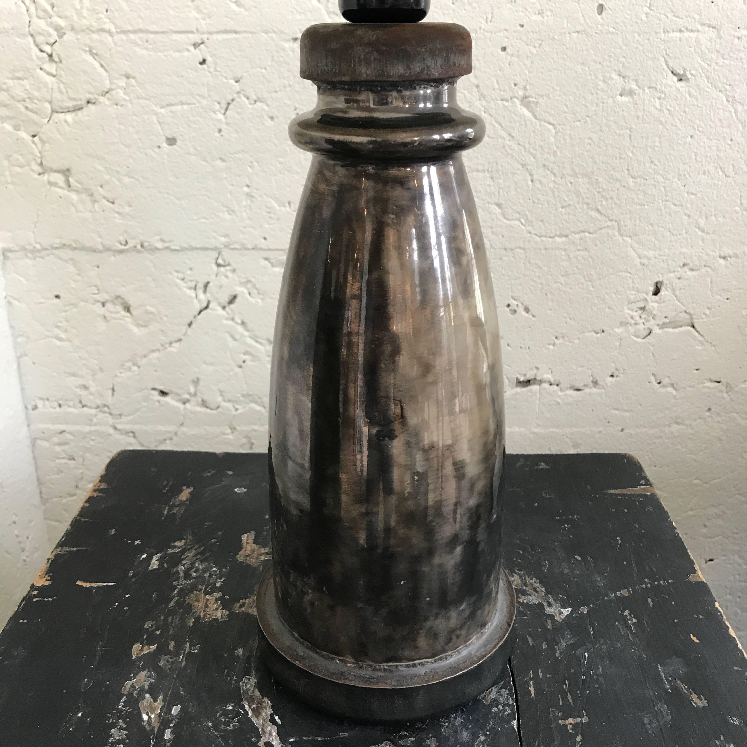 Ceramic Isolant lamp with shade.