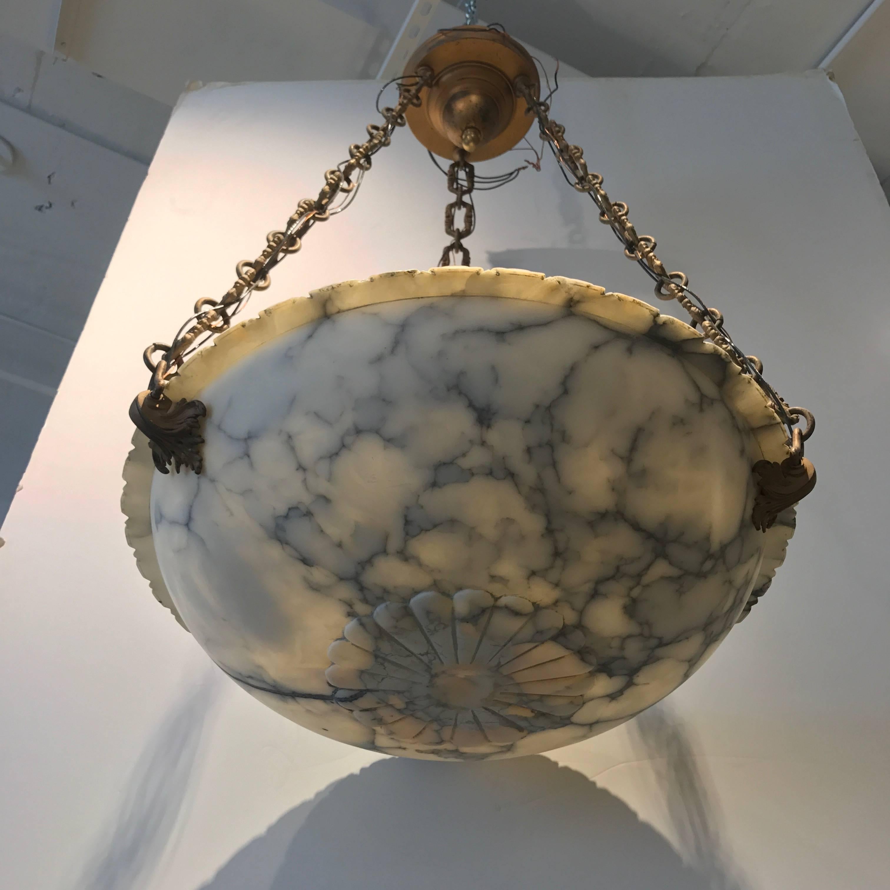 Carved alabaster bowl chandelier with bronze suspension, three lights.