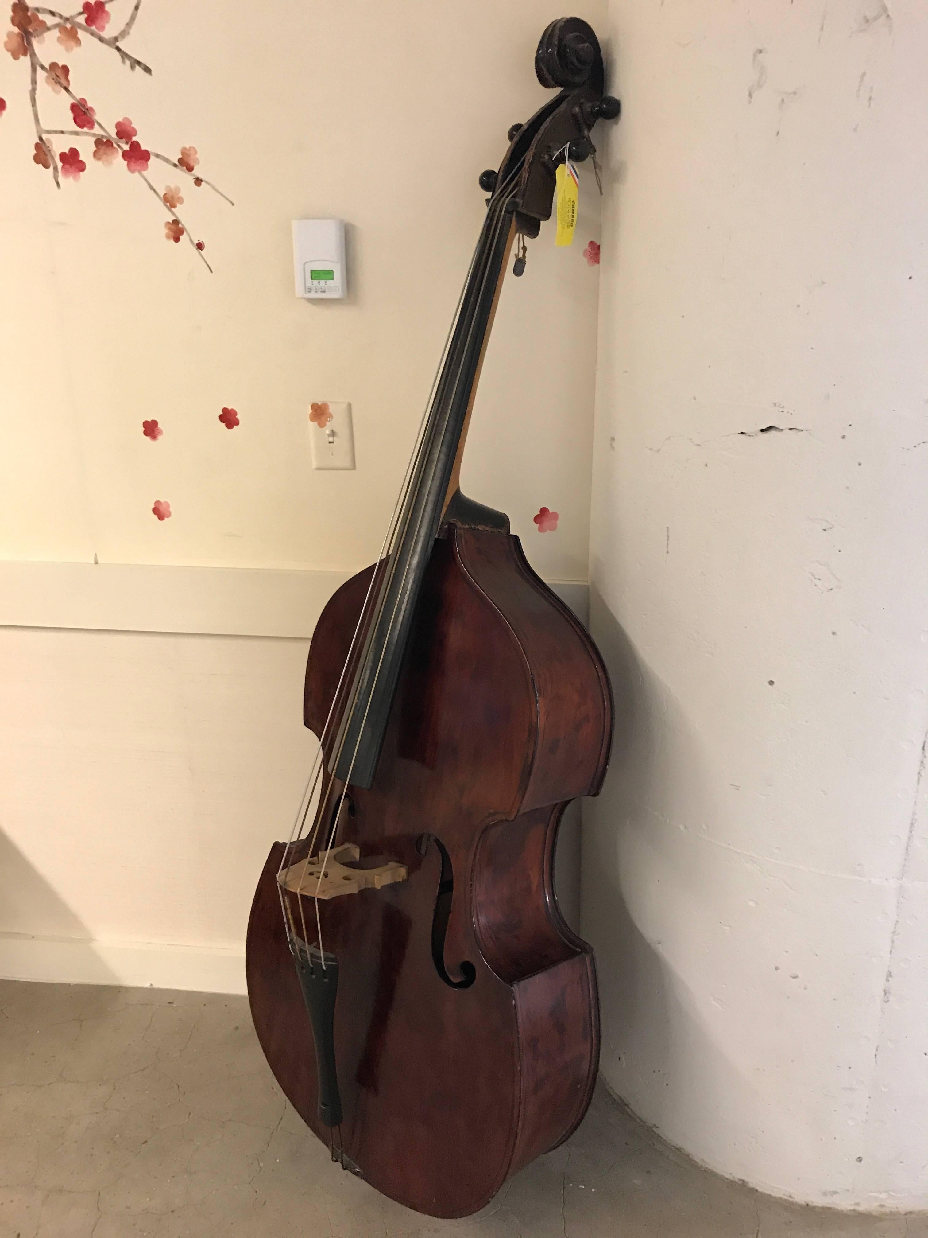 Early 20th century mahogany double bass. Inside label reads "Made in Czechoslovakia".