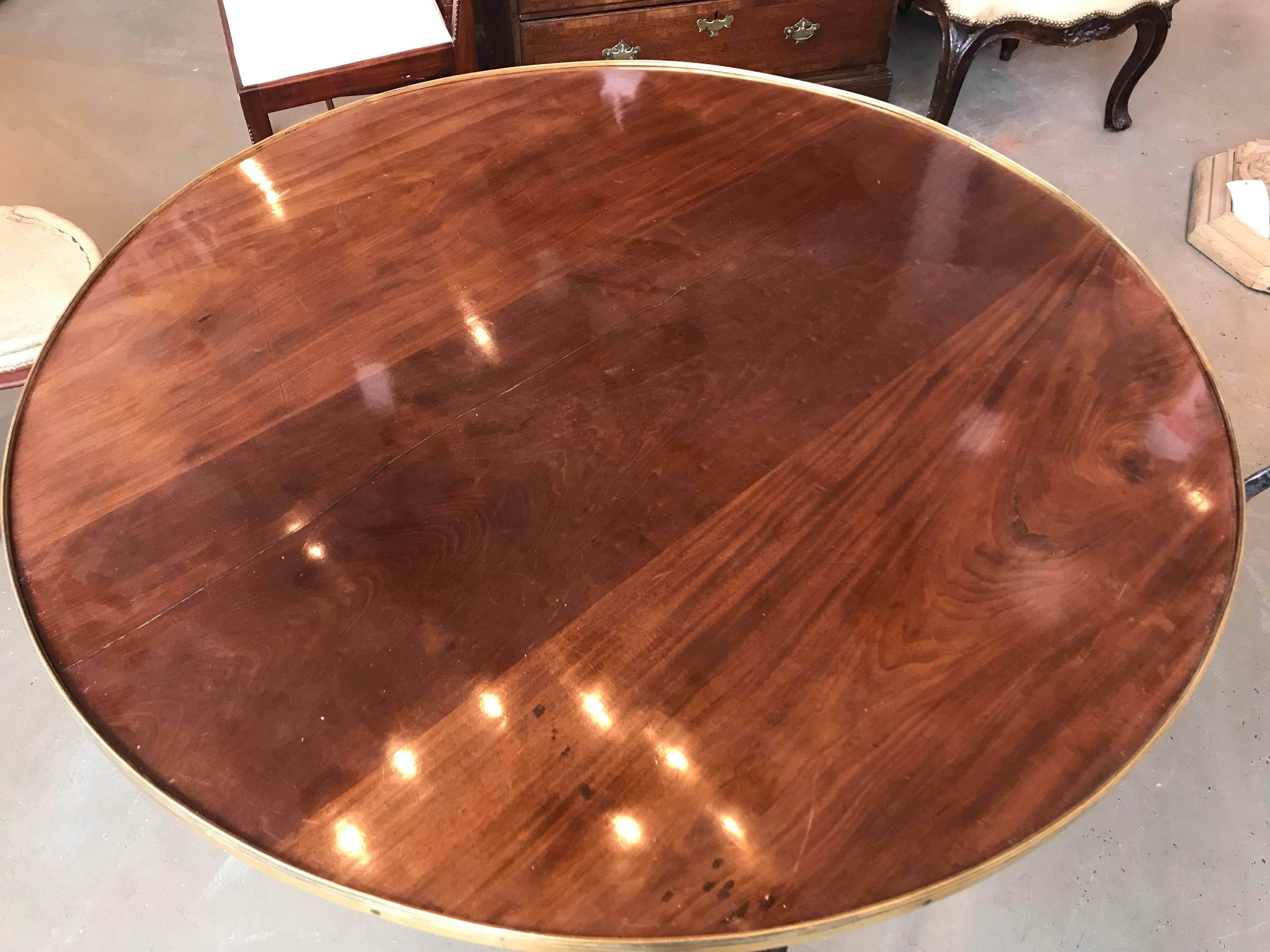 Period Napoleon Campaign table, mahogany with brass rail and three folding legs,
circa 1810.
 