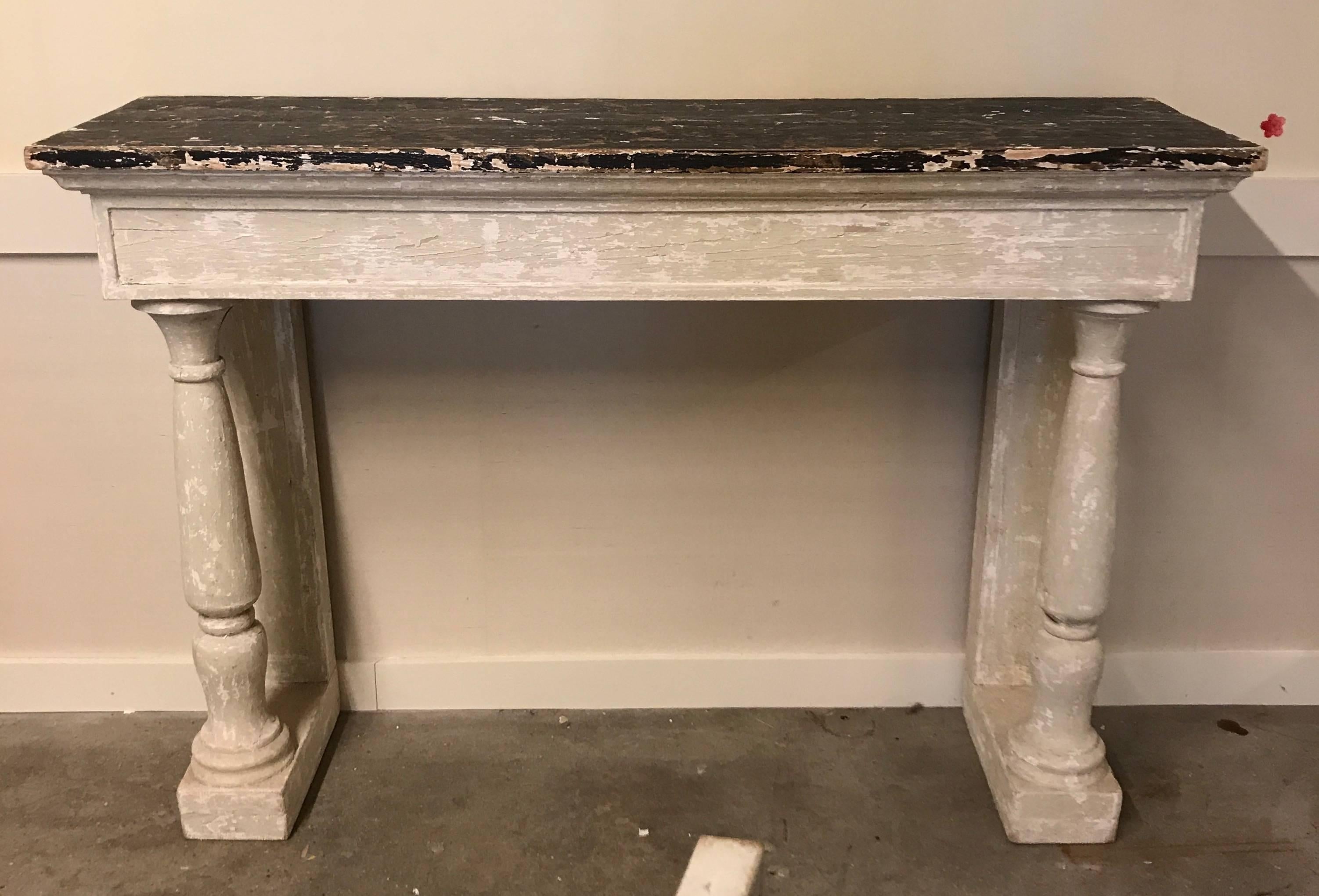Large-scale French painted consoles with turned column legs in an antique finish.