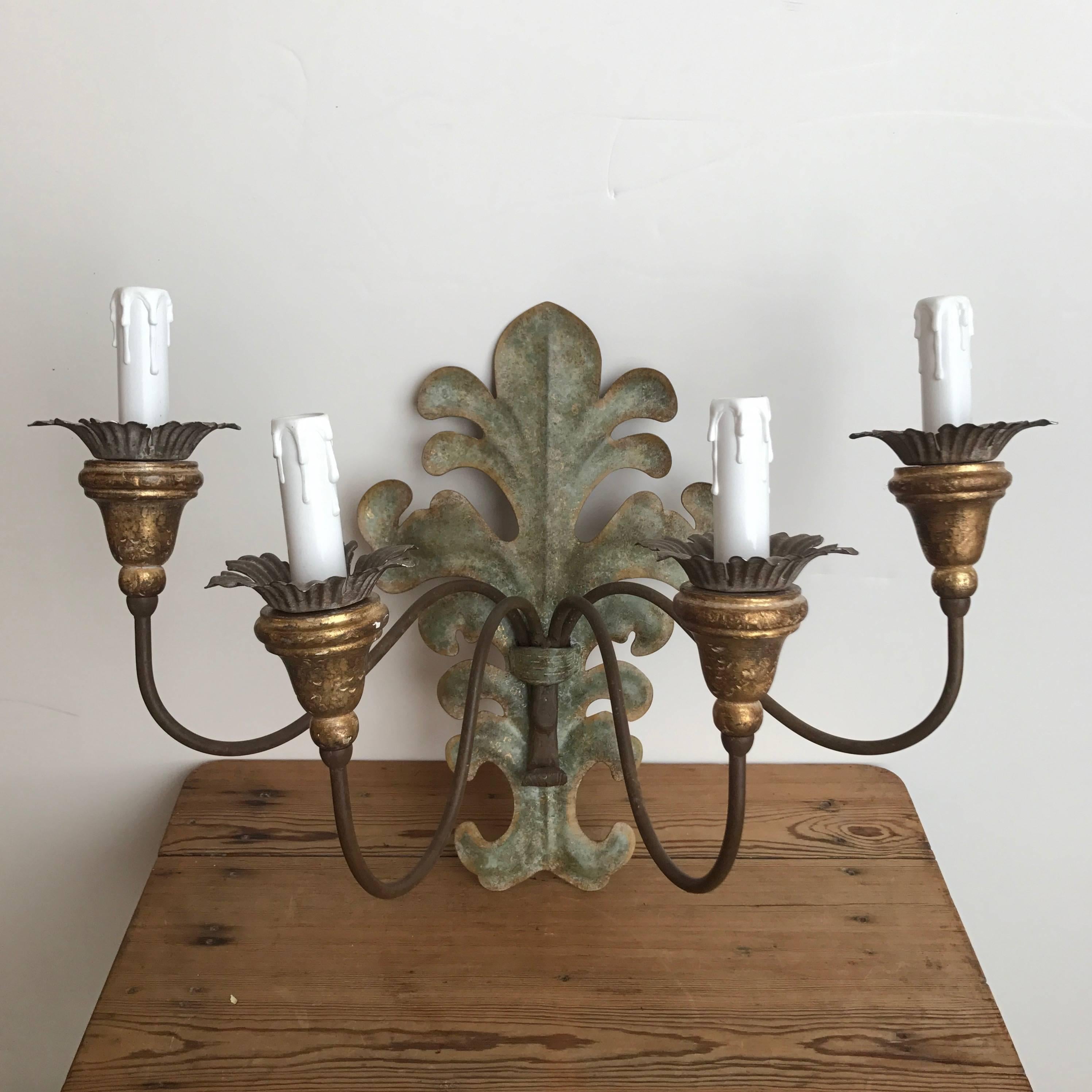 Pair of French 4-arm wood and tole sconces with decorative backplates. USA wired.