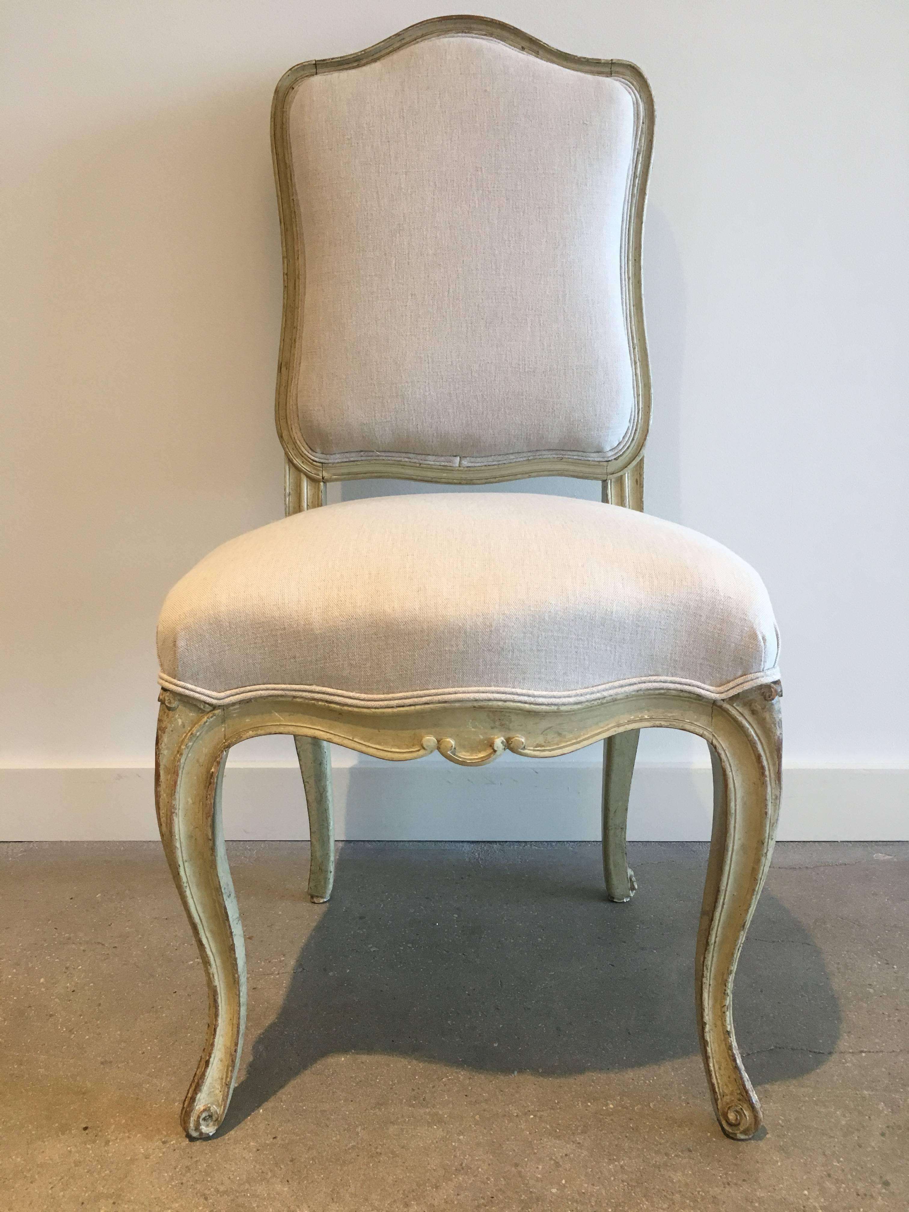 Set of six 19th century Louis XV dining chairs. Eggshell paint. Newly stabilized and reupholstered.