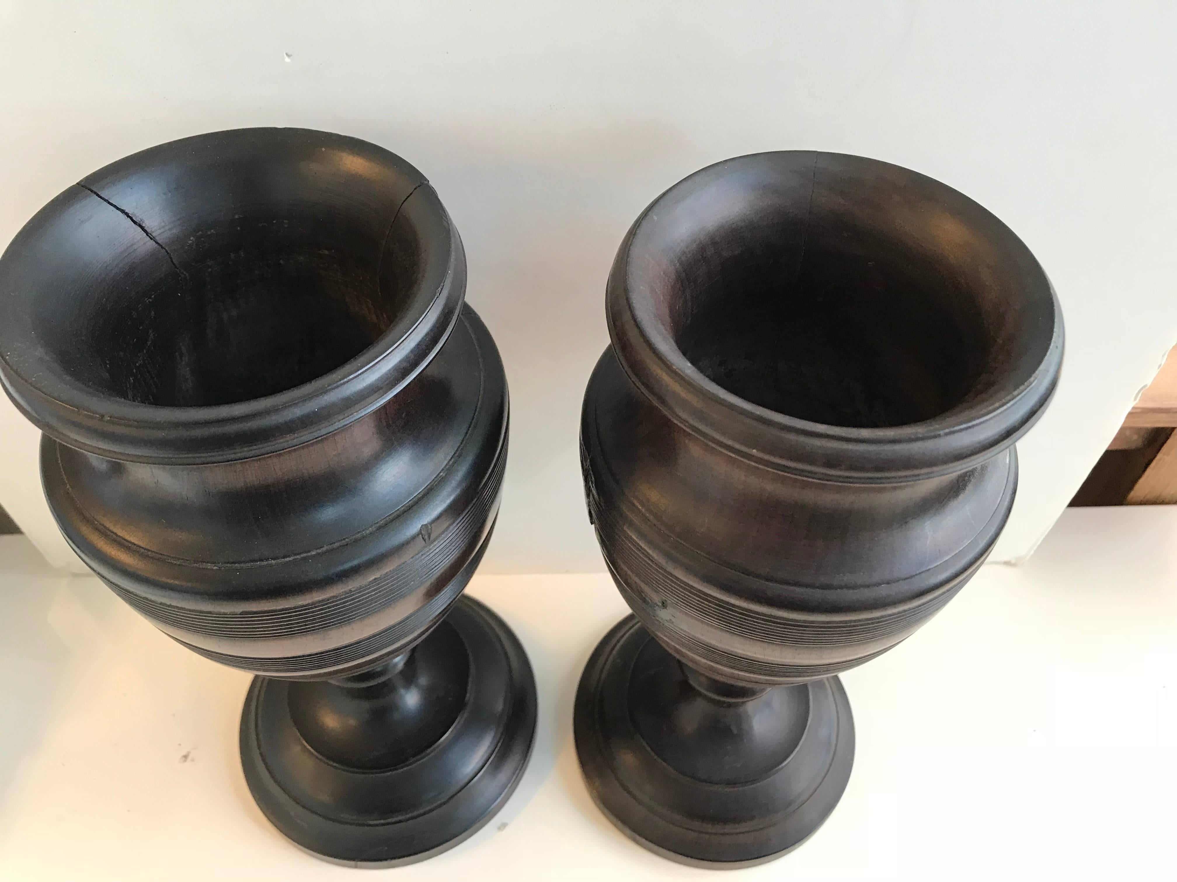 19th century pair of turned walnut vases. Dark color and substantially weighted.

