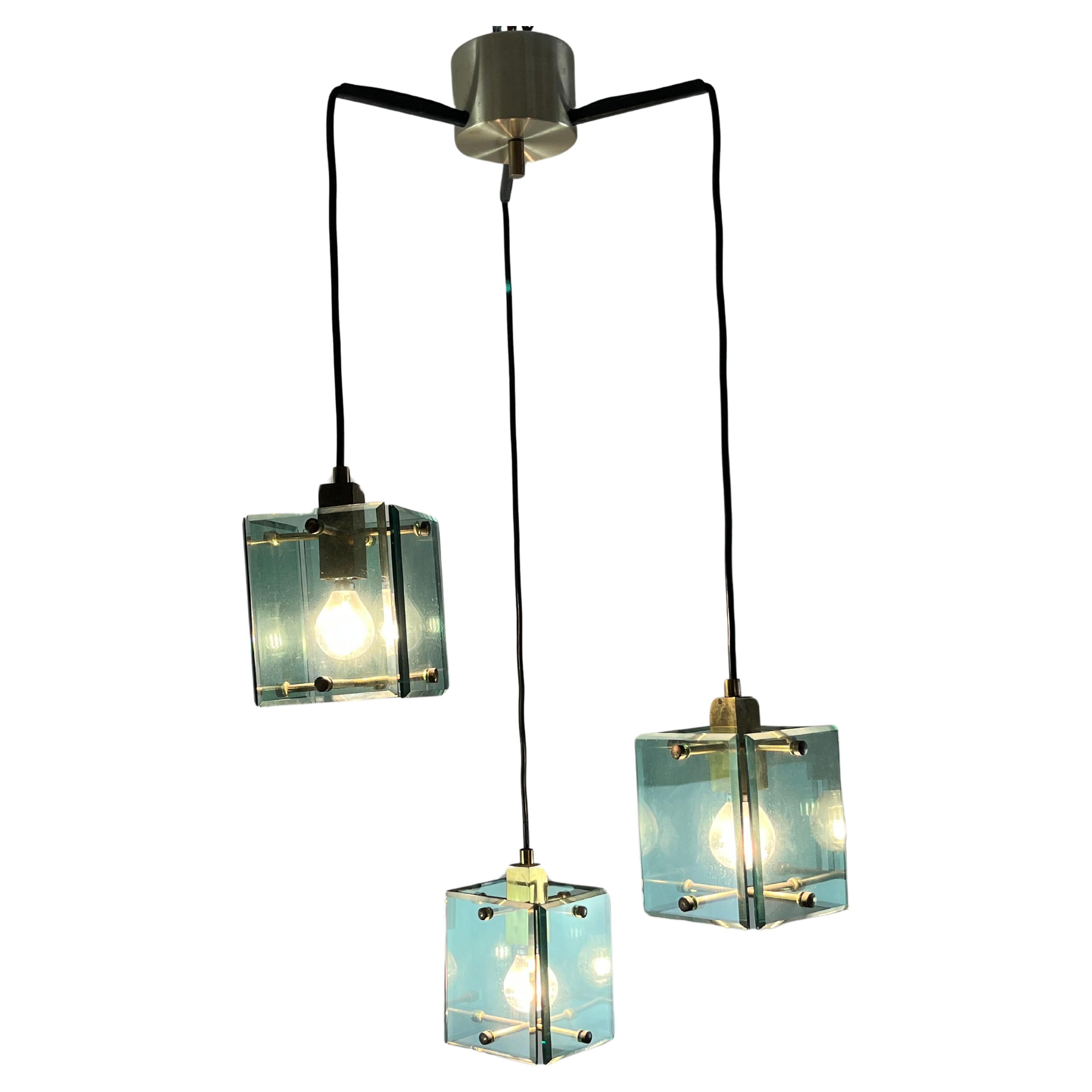 Vintage 3-light  pendant chandelier, attributed to Fontana Arte, 1960s
Made of brass and colored Murano glass, it is intact and functional. Found in a noble apartment.
