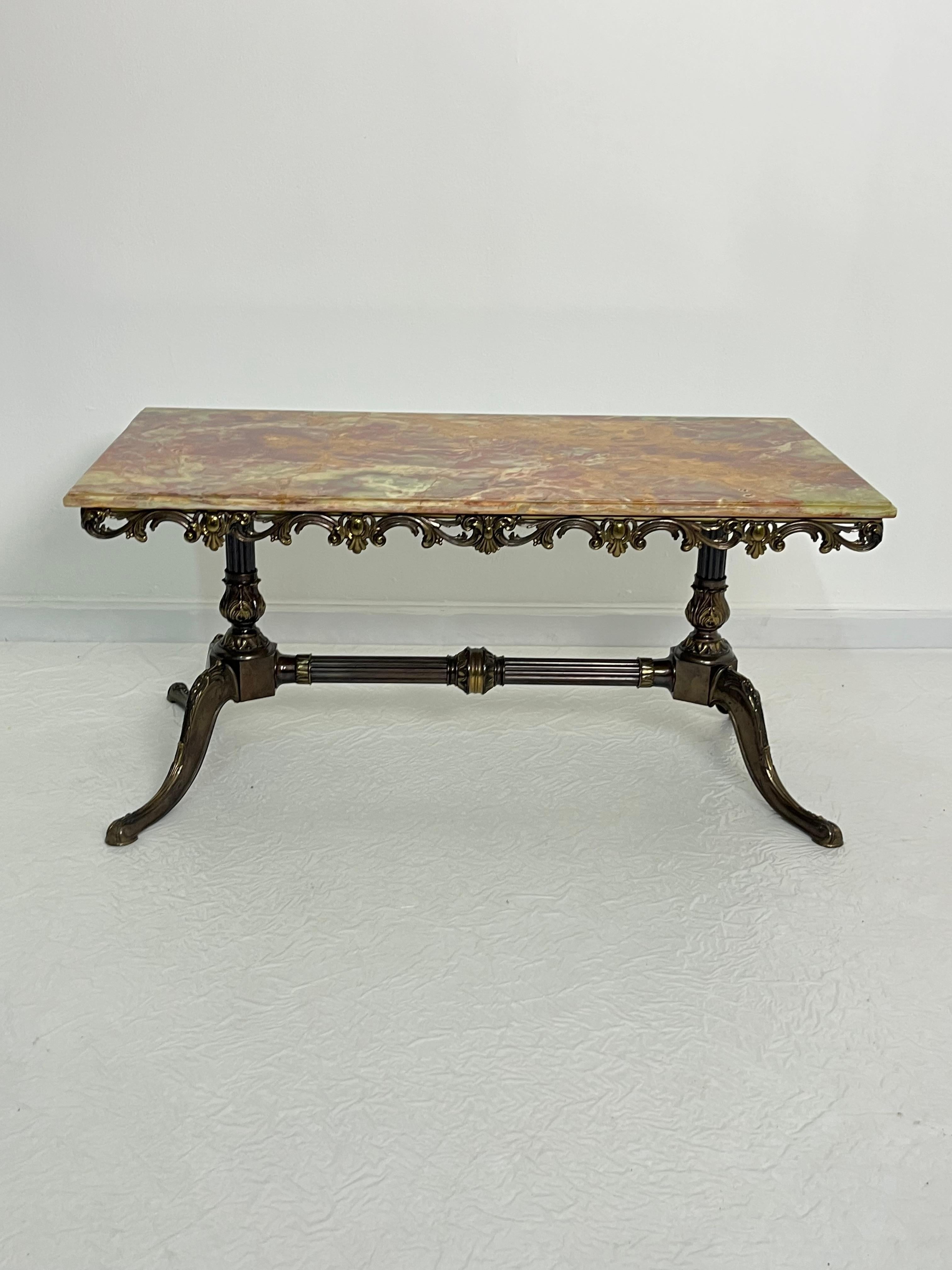 Mid-century French coffee table with marble top and ornate bronze base, 1950s
Intact and in good condition.

Insured shipping with suitable packaging via DHL courier.