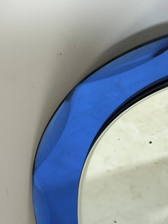 Wall mirror with a faceted colored glass frame attributed to Cristal Arte, 1960s