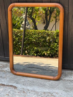 Large Bronze-tinted Mirror with a curved walnut wood frame, 1970s