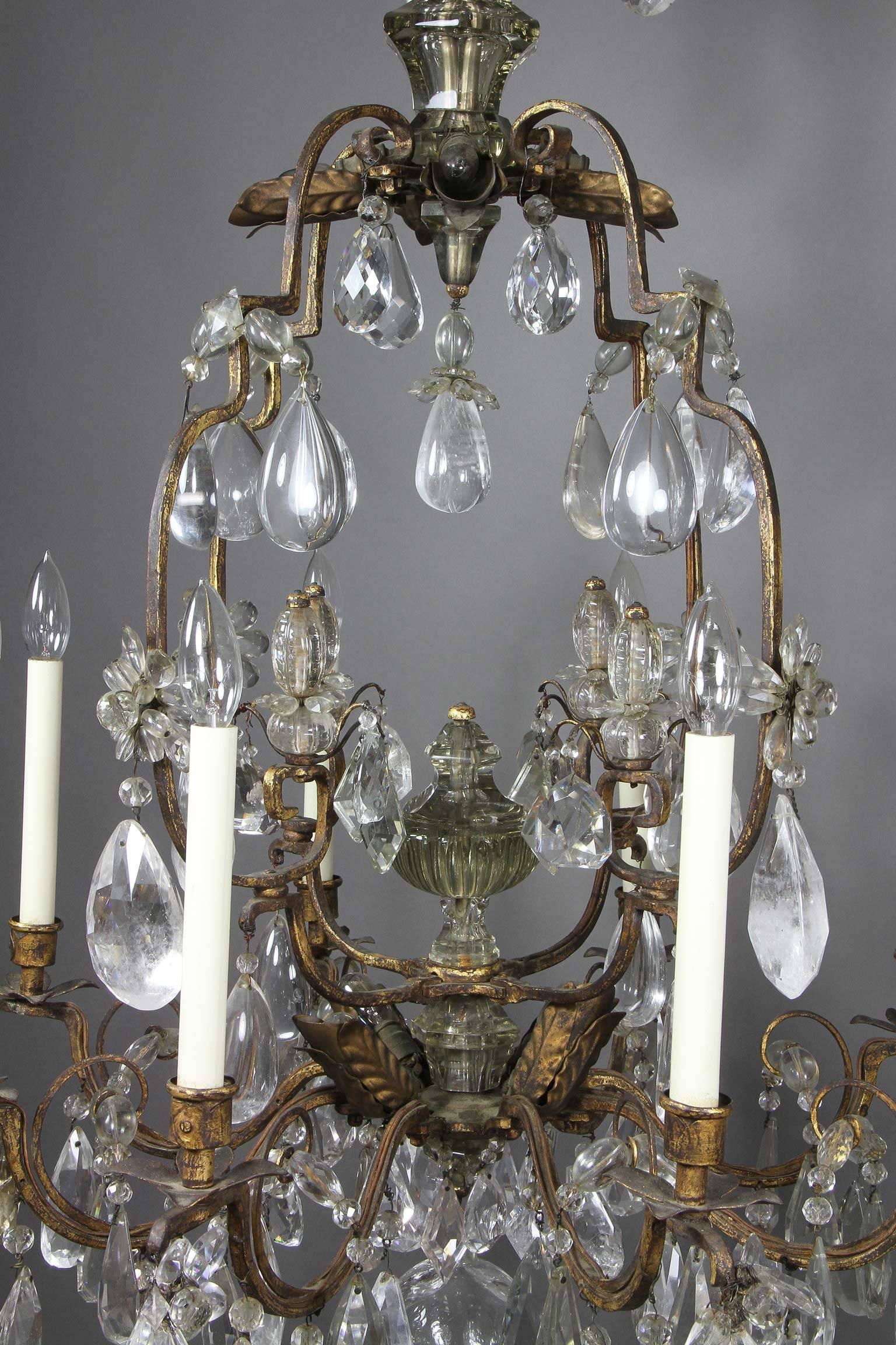 Typical form with four small arms with drops over a cage with drops overall and central urn over eight branches with lights. Very similar chandelier in the Legion Of Honor Art Museum in San Francisco. Gift of Consuelo Vanderbilt Balsan.