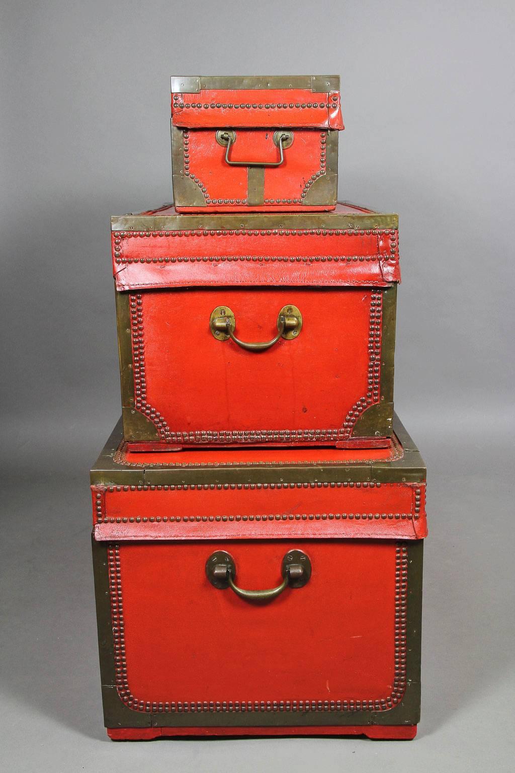Nest of Three Chinese Export Red Lacquered Leather Trunks 1