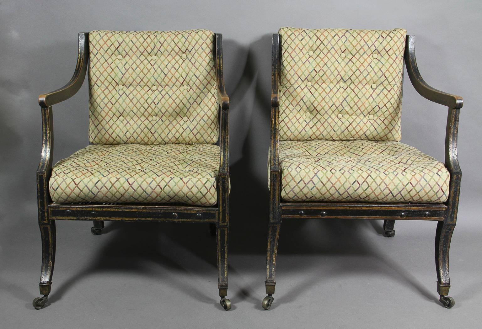 English Pair of Regency Ebonized and Gilded Caned Armchairs