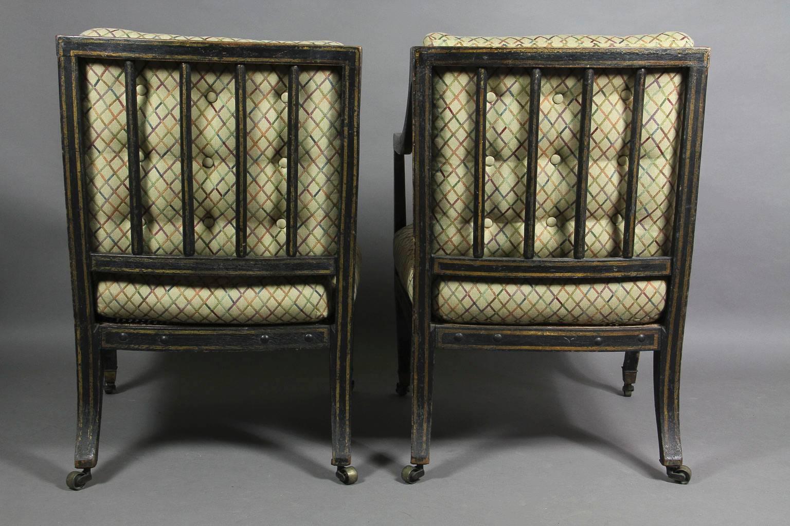 19th Century Pair of Regency Ebonized and Gilded Caned Armchairs