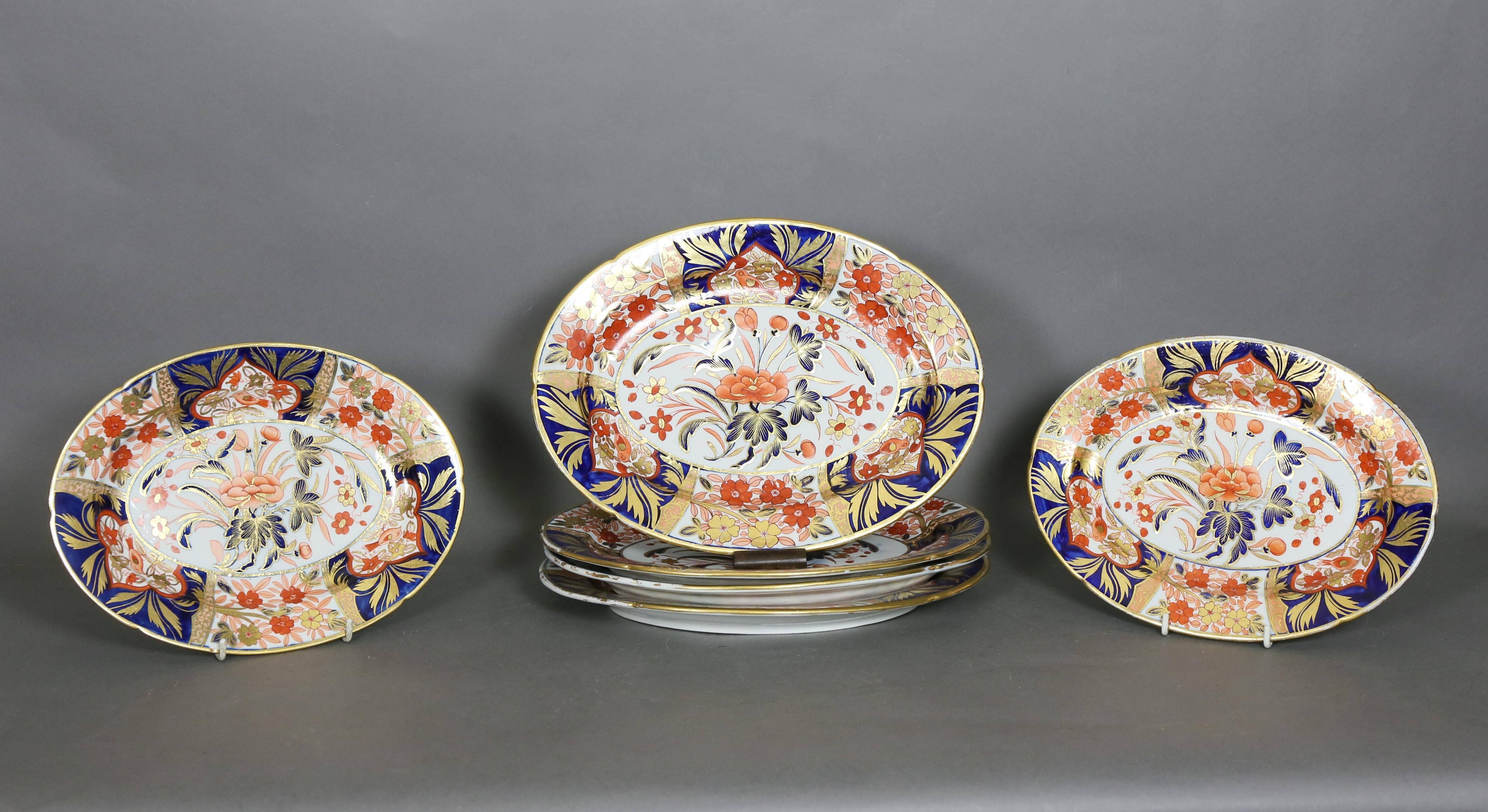 An intricate design of flowers and birds in red, blue, and gold on a white field. There are minor differences in the design on each piece.

Set includes:
Nine dinner plates/9.38" D
Three soup plates/9.75" D
One sauce tureen/7" W