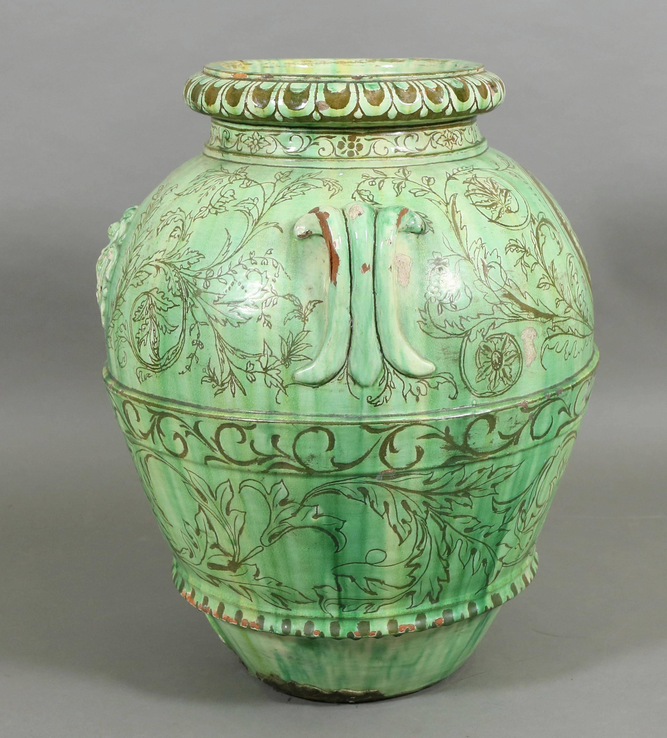 Blueish green glaze, baluster form with cartouche on one side and gargoyle face on reverse. Signed Maria on side. Featured in the movie Knives Out.