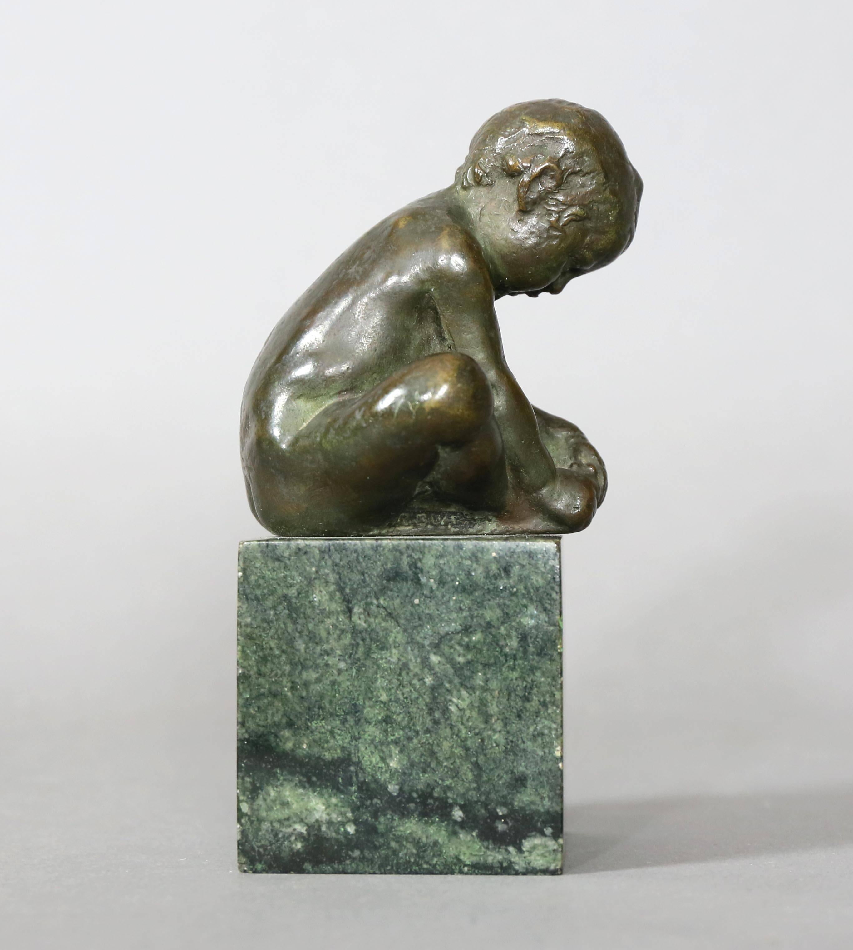 Beautifully cast and signed with initials R.B.W.I. Seated figure with hands clasping feet. Green granite base.