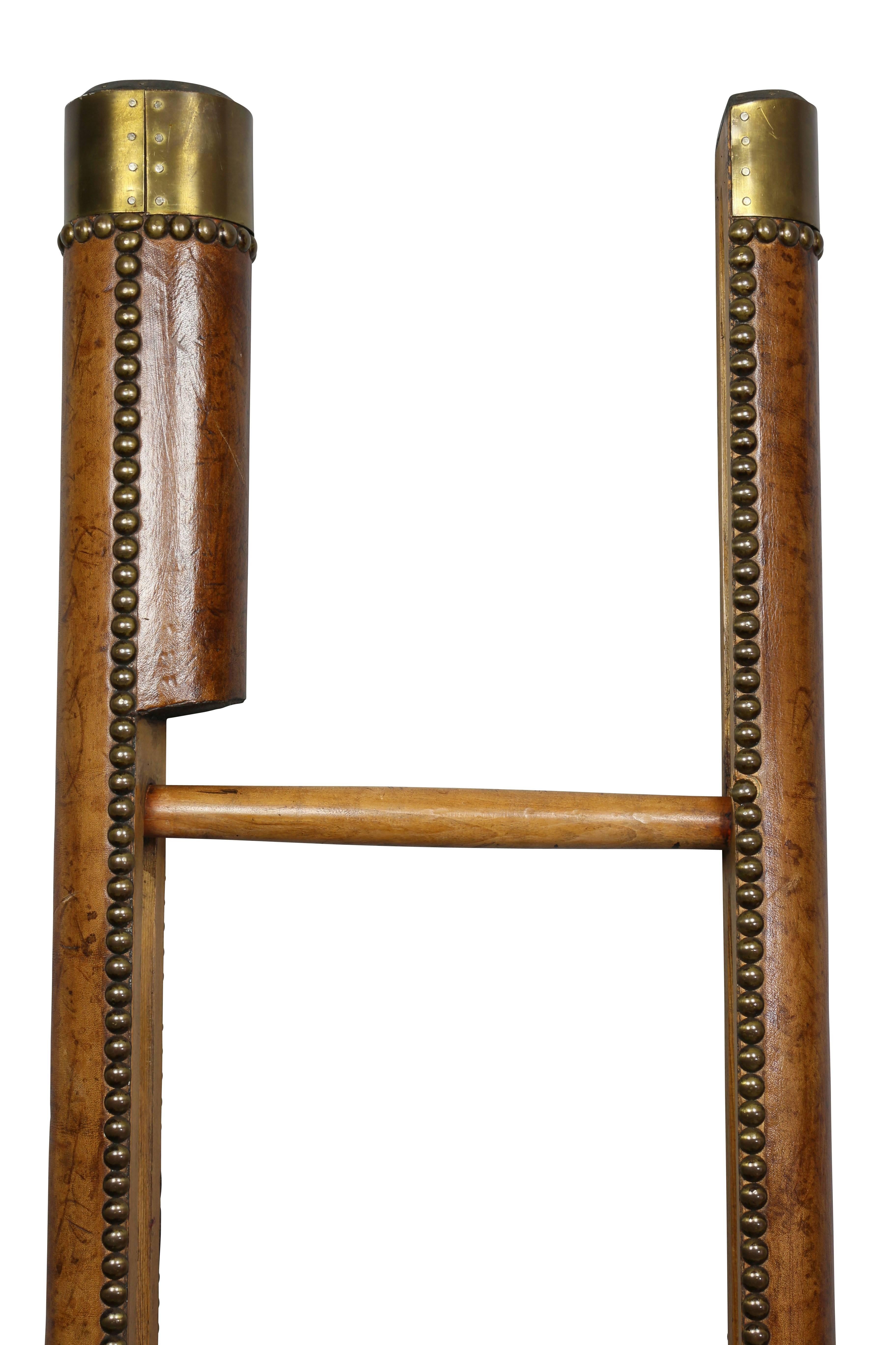 Edwardian brown leather and brass tack library stick ladder. Typical form.