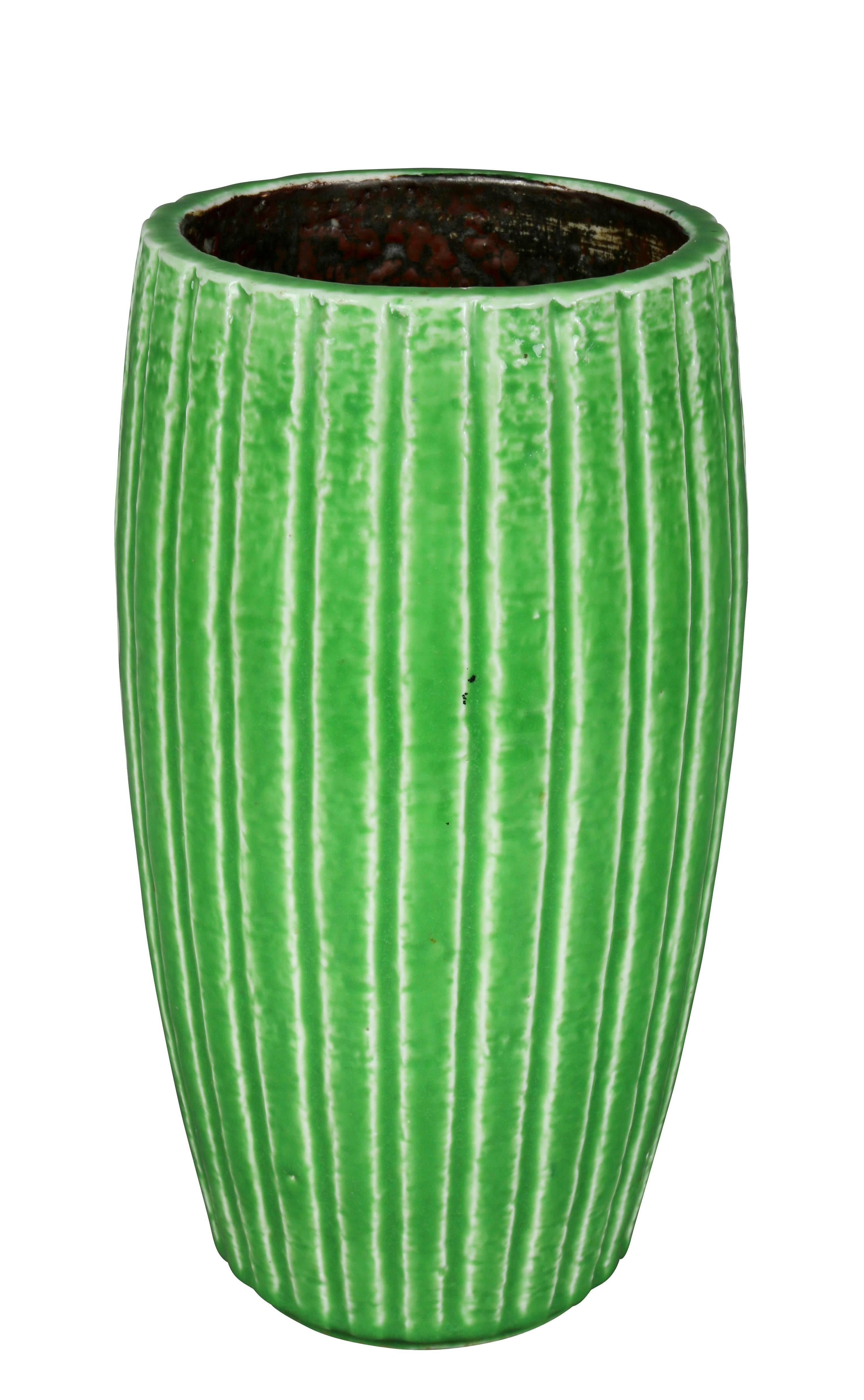 Green glaze, vertical ribbed cylindrical form. Signed on base.